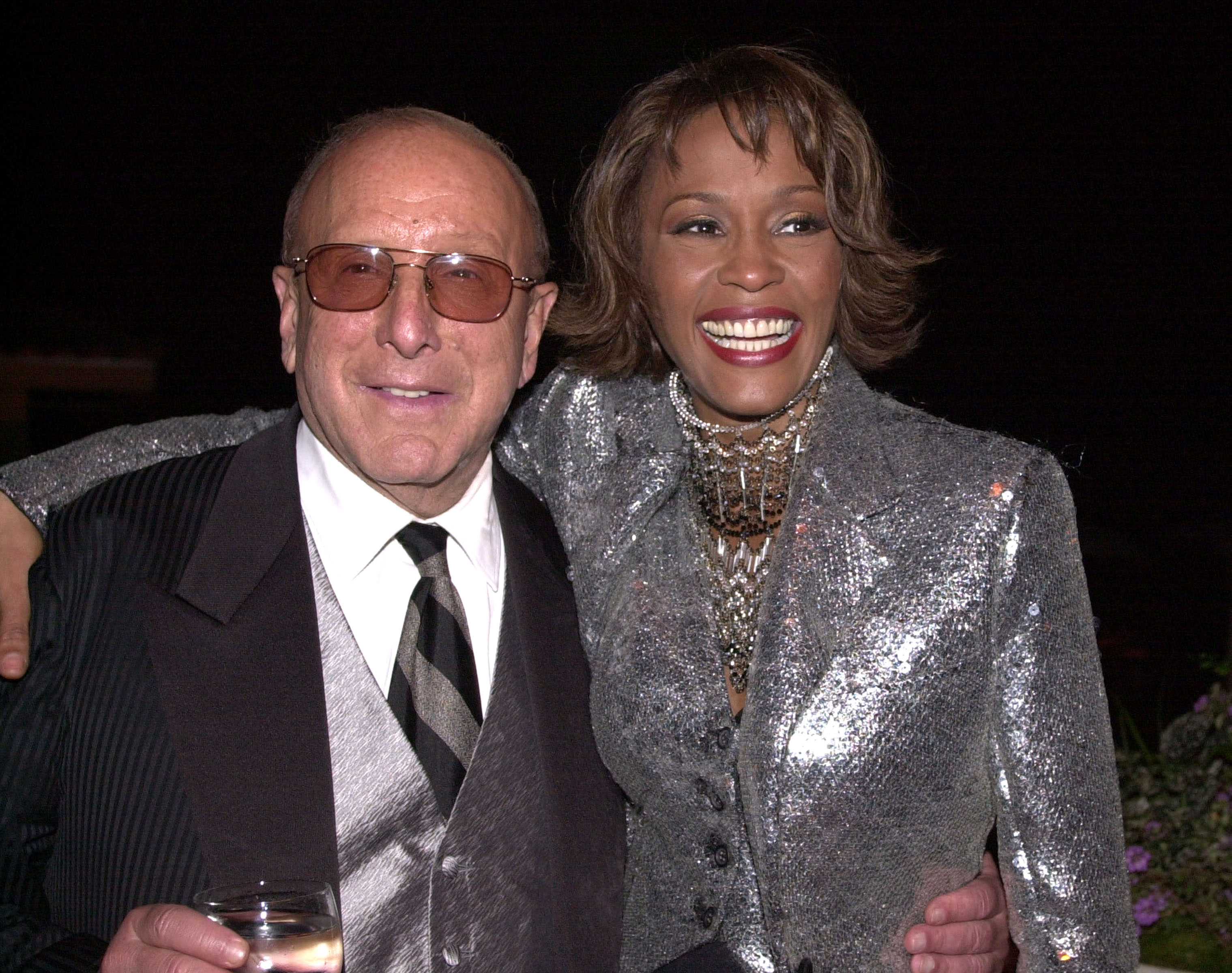 Clive Davis & Whitney Houston at the Private House in Los Angeles, California in 2000 | Source: Getty Images