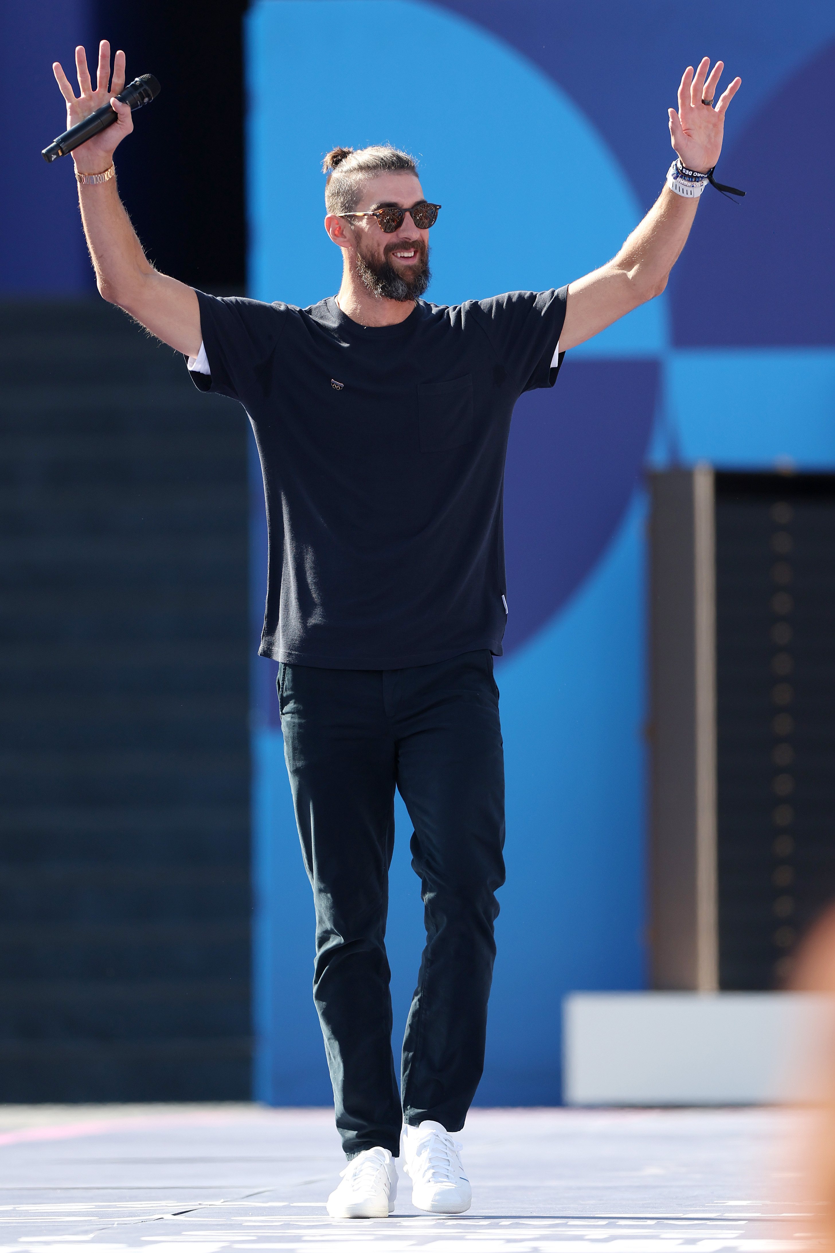 Michael Phelps waves to fans at Champions Park at the Olympic Games Paris 2024 in Paris, France, on August 6, 2024. | Source: Getty Images