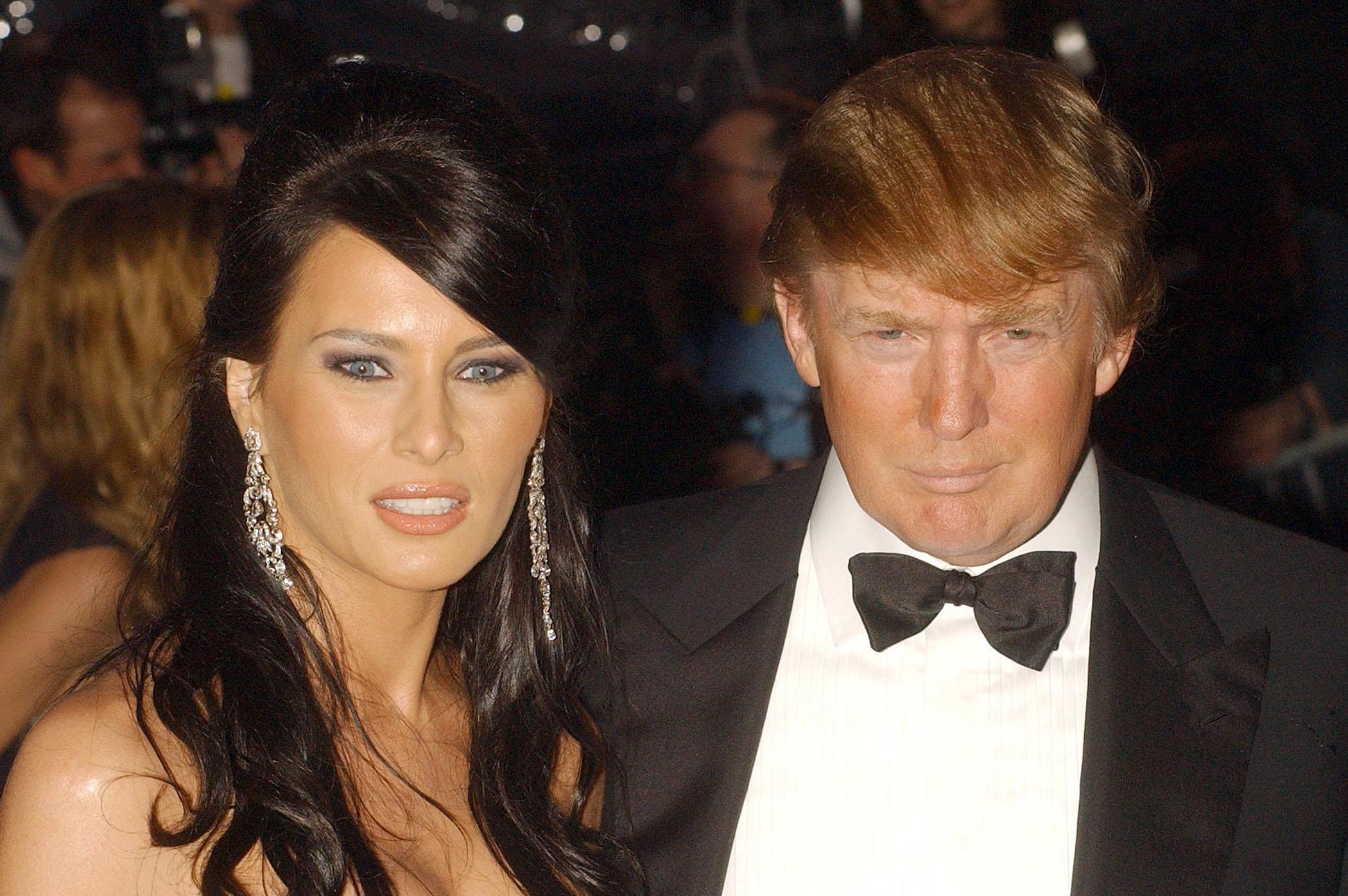 An up-close shot showcases Donald's signature blonde hair, while Melania's brunette locks shine against the backdrop of the evening. She wore dangling silver earrings, perfectly complementing the stunning proposal ring she received at the Met Gala on May 2, 2005.