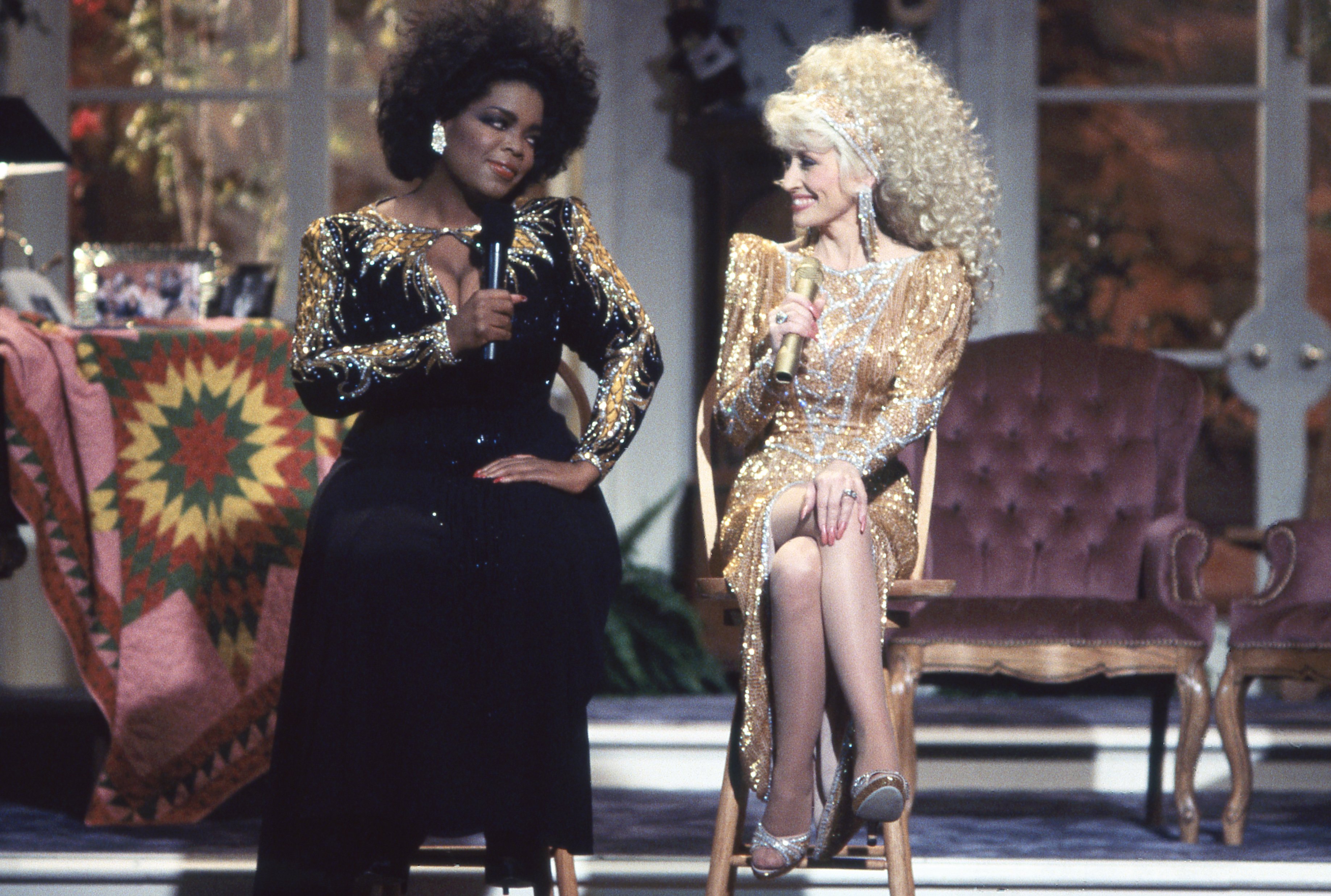 Dolly Parton and Oprah Winfrey sit next to each other on the "Dolly" Variety Show in 1987 | Photo: Getty Images