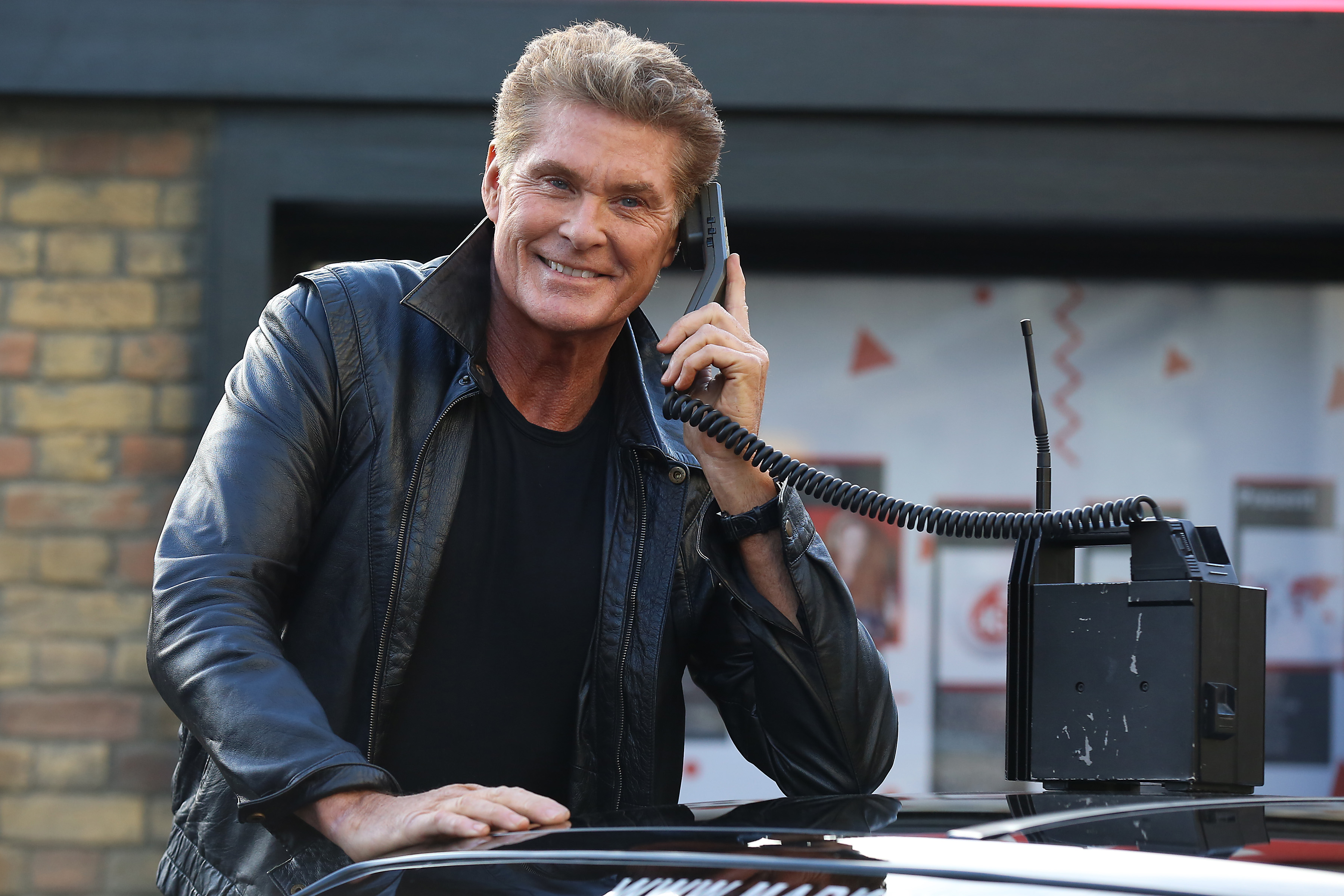David Hasselhoff and KITT attend a photocall to launch G Street, a 1980s-inspired pop up at Covent Garden on January 14, 2015, in London, England.