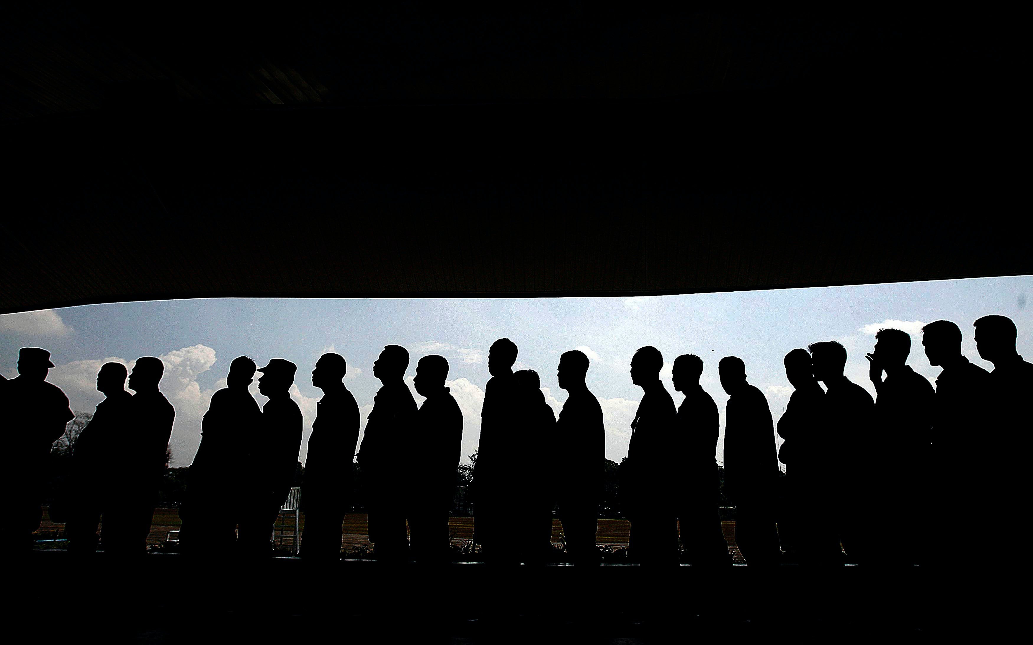 A group of men on a queue | Photo: Pexels