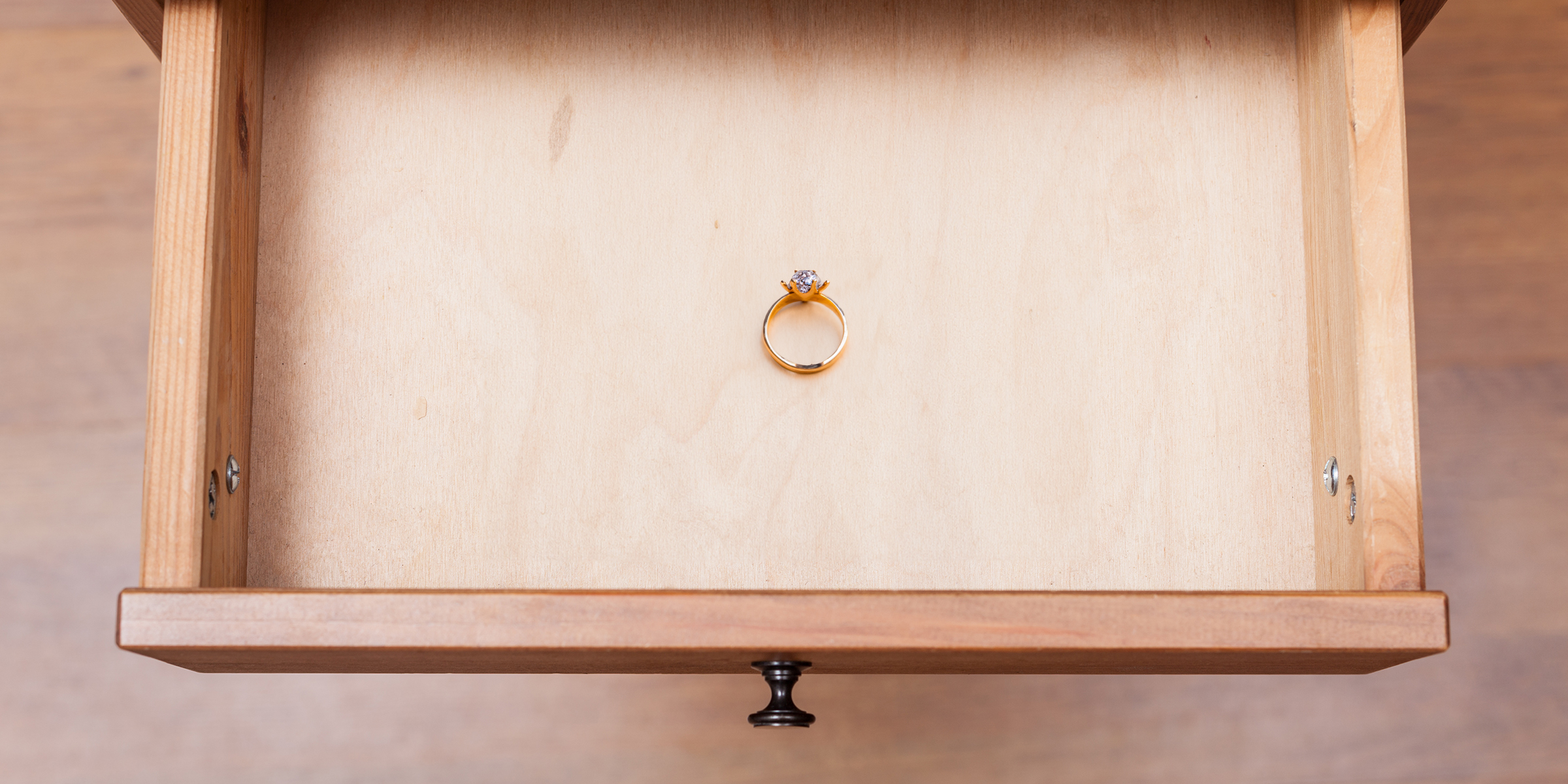 A diamond ring lying in an open drawer | Source: Shutterstock