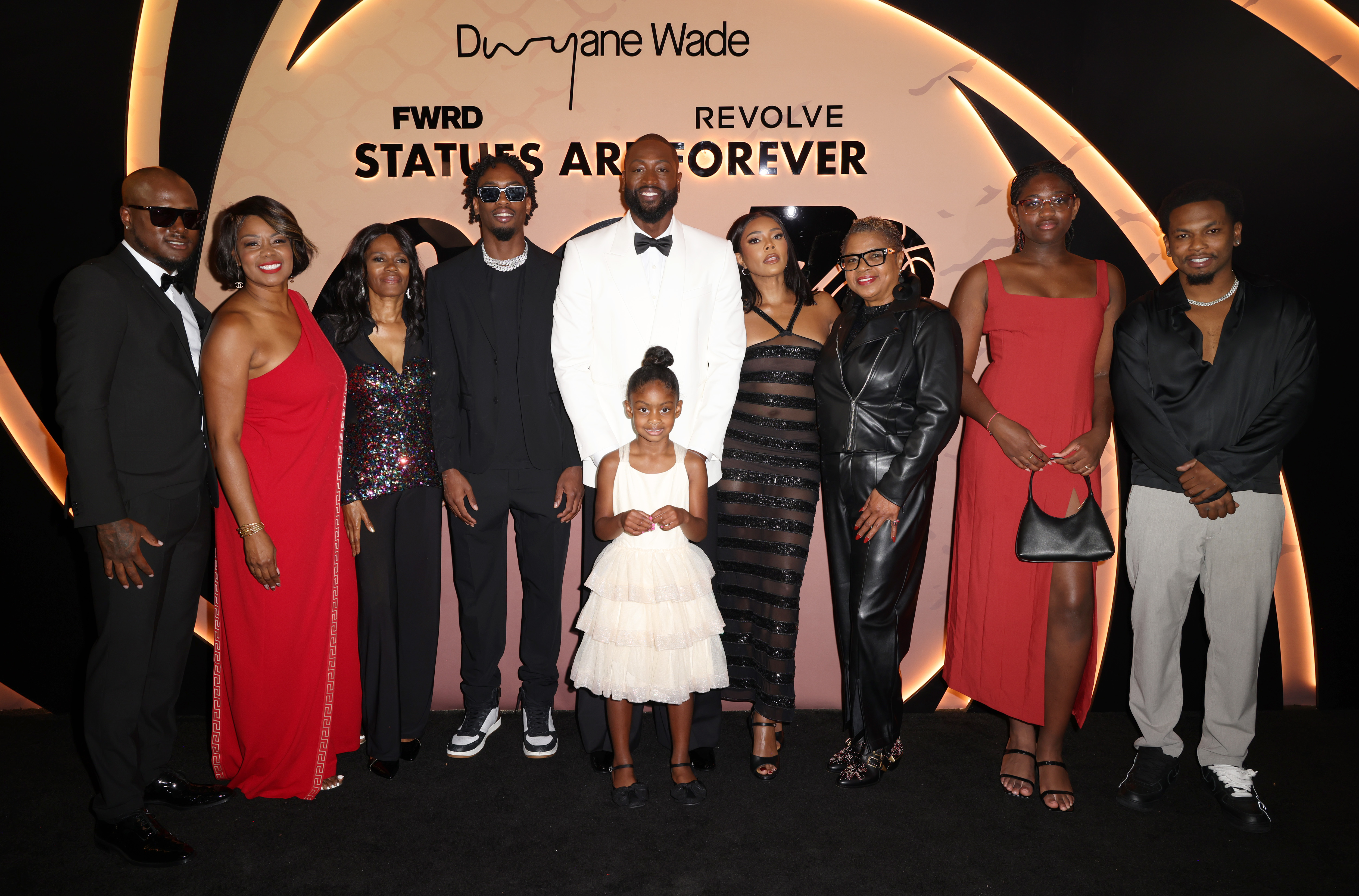 Kenny Kinder, Tragil Wade, Zaire Wade, Kaavia Wade, Gabrielle Union, Jolinda Wade, Zaya Wade, and Dahveon Morris attend Dwyane Wade's "003 Statues are Forever" party at Queen Miami Beach in Florida on October 25, 2024 | Source: Getty Images