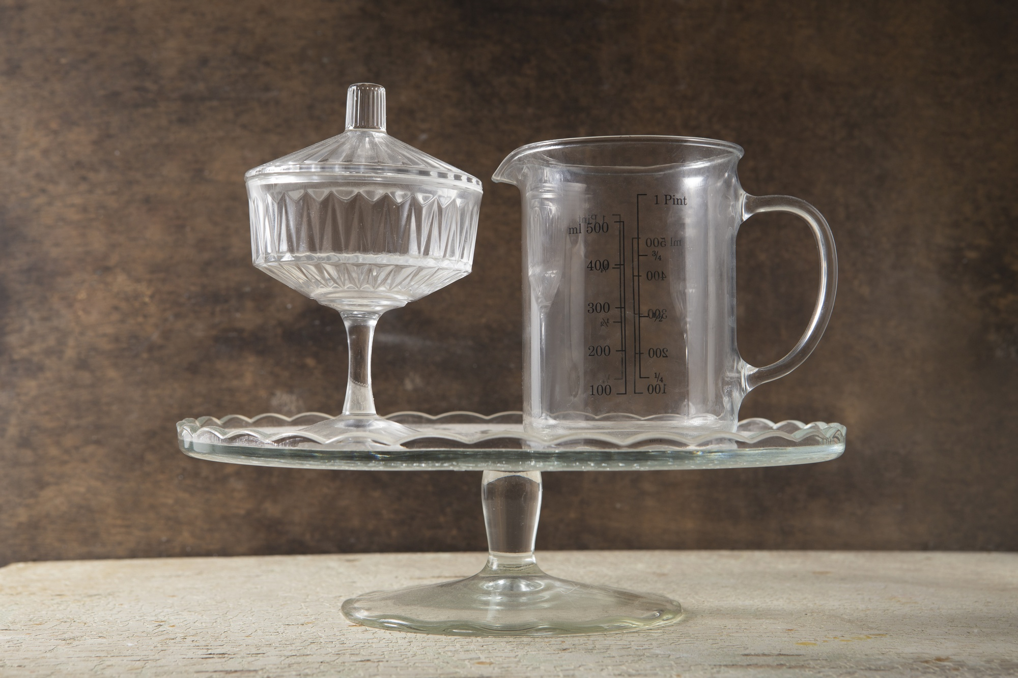A measuring jug sitting with other baking tools | Source: Freepik