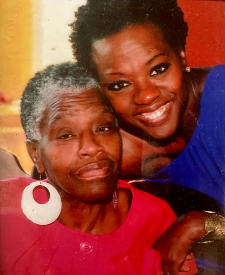 The author smiles beside her mother in a heartfelt family photo shared in celebration of her birthday, from a post dated May 4, 2024. | Source: Instagram/violadavis