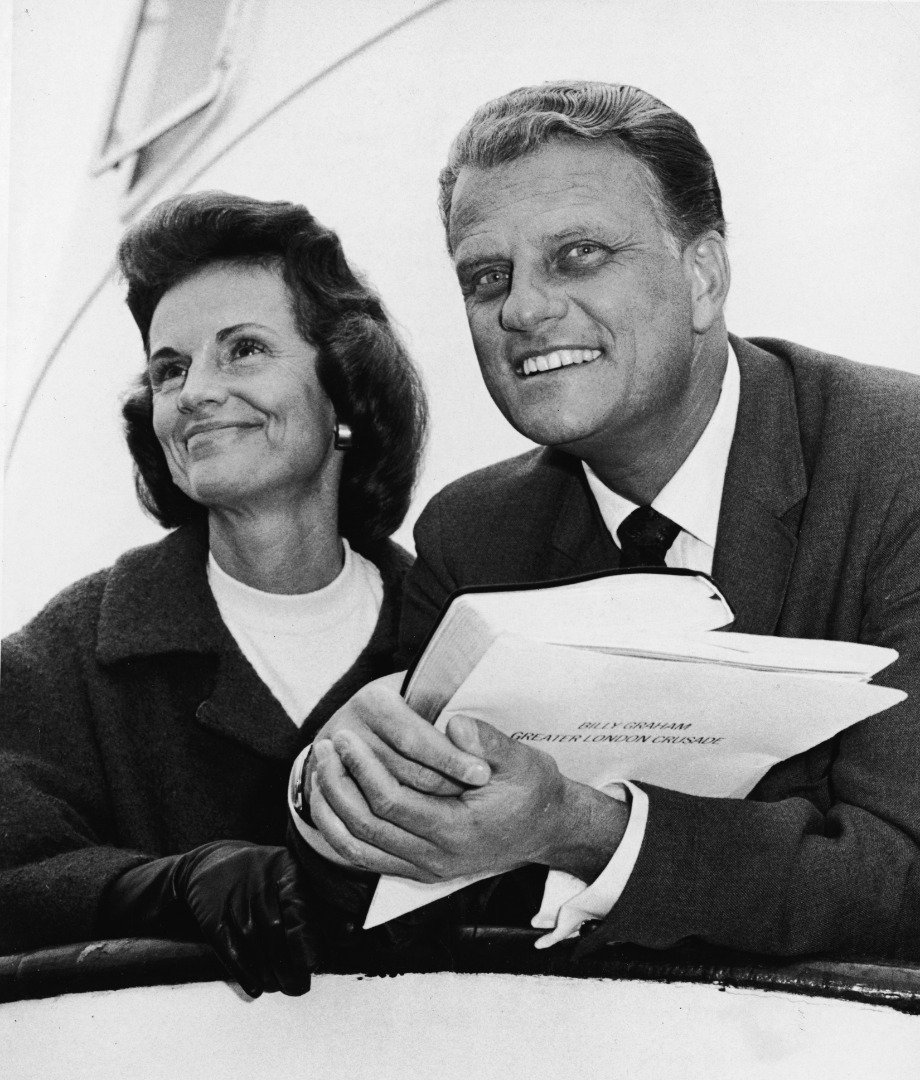 American evangelist Billy Graham and his Chinese-born wife, Ruth, on board the 'Queen Mary' before their departure for London to launch the 'Greater London Crusade,'  New York, New York, May 18, 1966. | Source: Getty Images