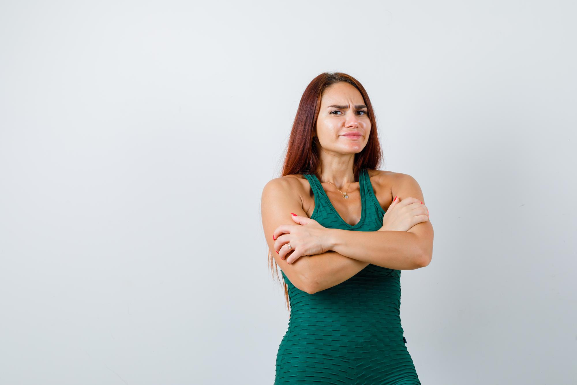 A woman with an attitude with her arms folded across her chest | Source: Freepik