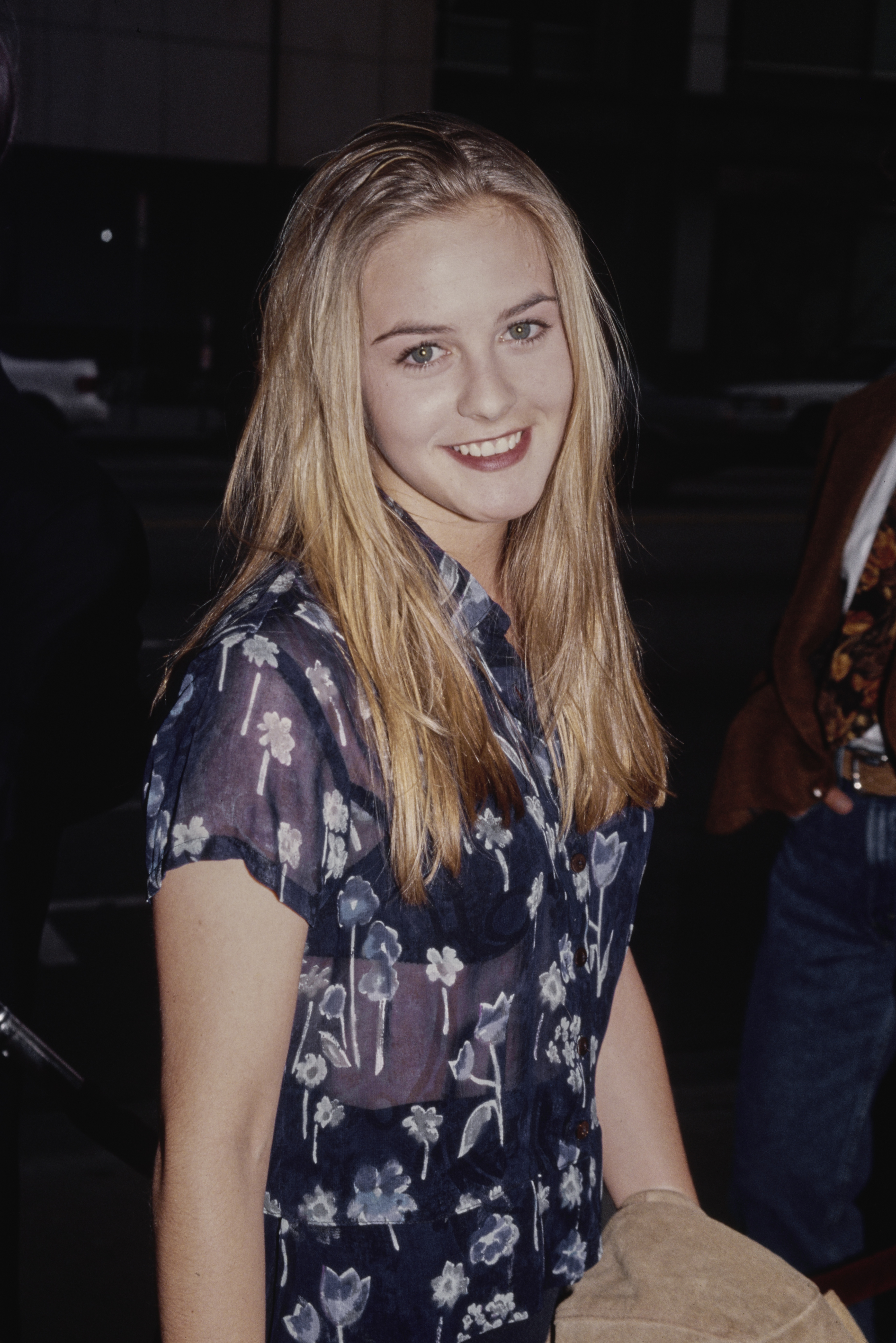 Alicia Silverstone attends the "Forget Paris" Los Angeles premiere at the Academy Theater on May 15, 1995, in Los Angeles, California.