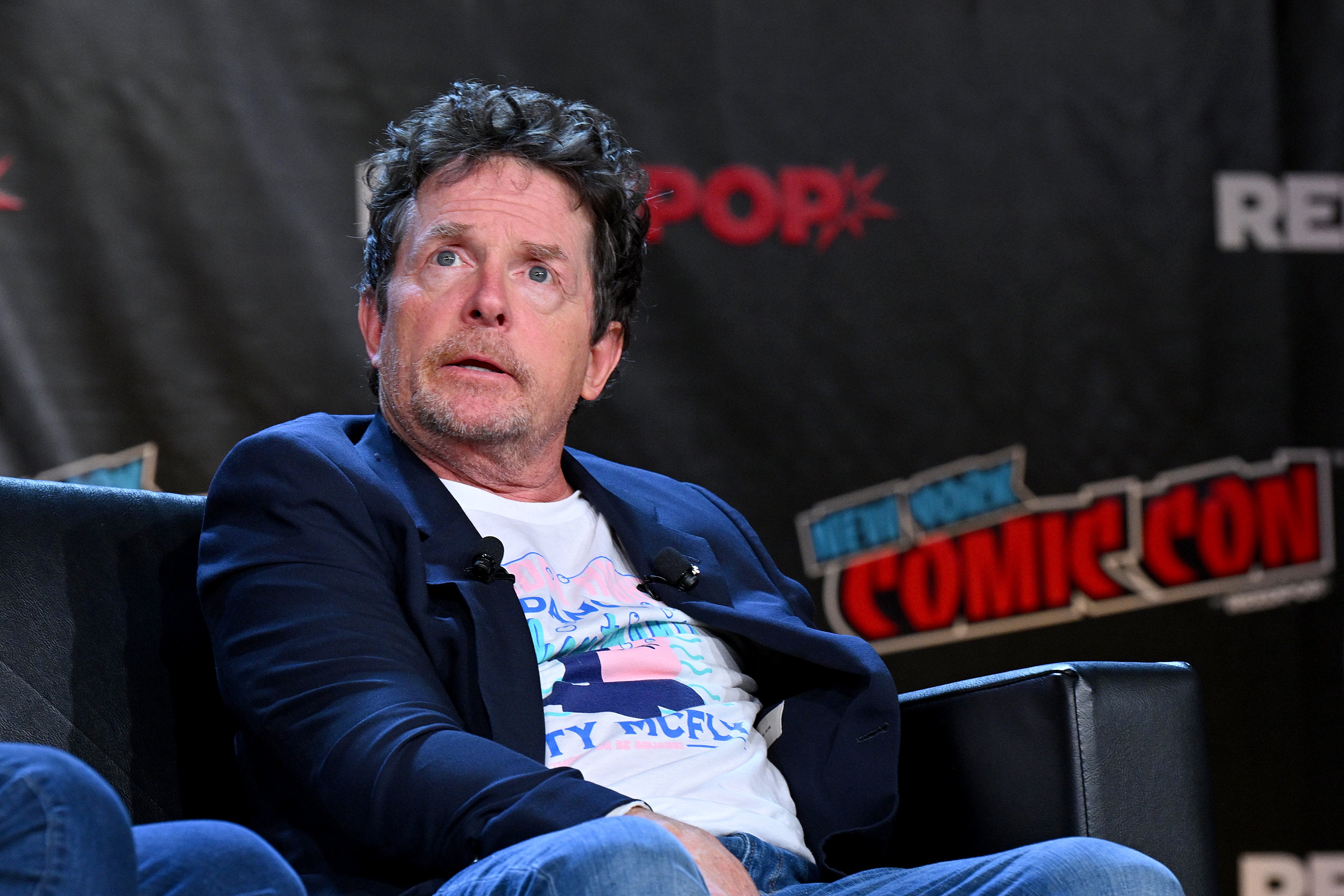 Michael J. Fox onstage at the "Back to the Future" Reunion during New York Comic Con on October 8, 2022, in New York City | Source: Getty Images