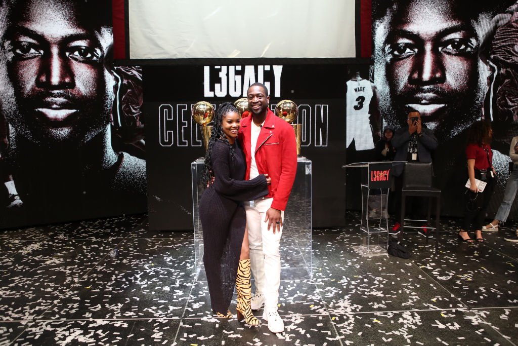 Dwyane Wade poses for a photo with his wife Gabrielle Union during the Jersey Retirement Flashback Event,2020| Photo: Getty Images