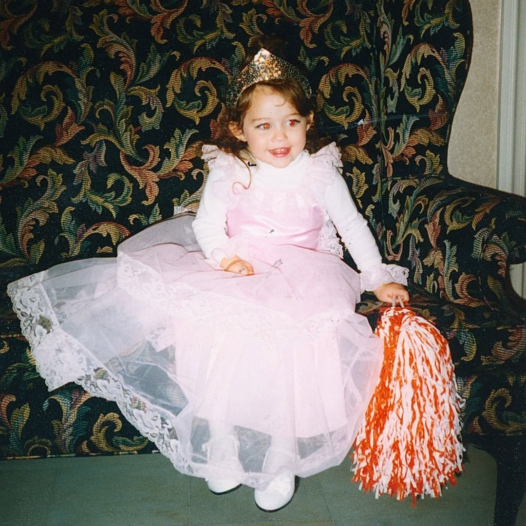 The child star pictured on the couch, dated February 2021 | Source: Instagram/mileycyrus