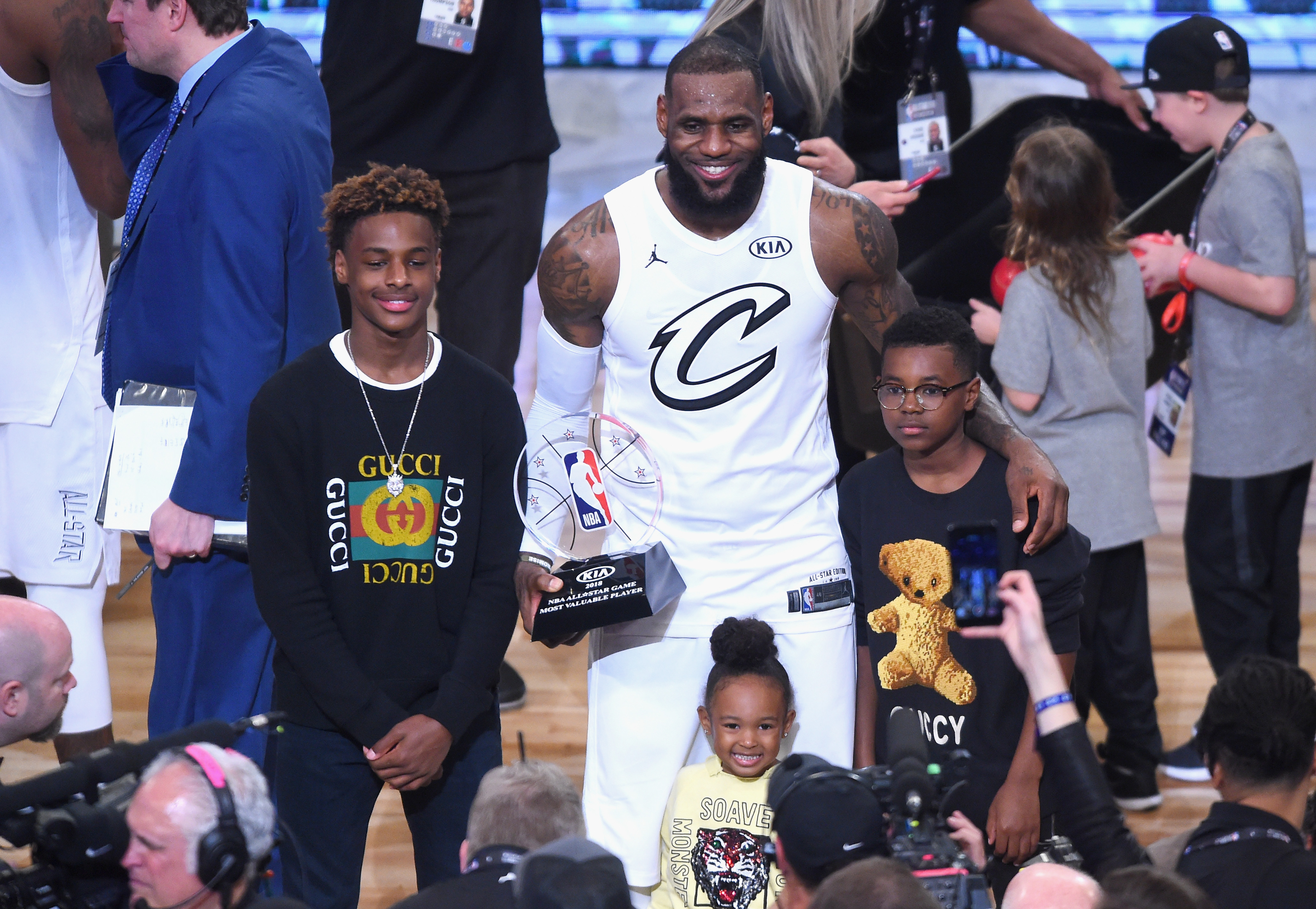 LeBron James Jr., LeBron James #23, Zhuri James and Bryce Maximus James pose for a photo with the All-Star Game MVP trophy during the NBA All-Star Game 2018 at Staples Center on February 18, 2018, in Los Angeles, California | Source: Getty Images.