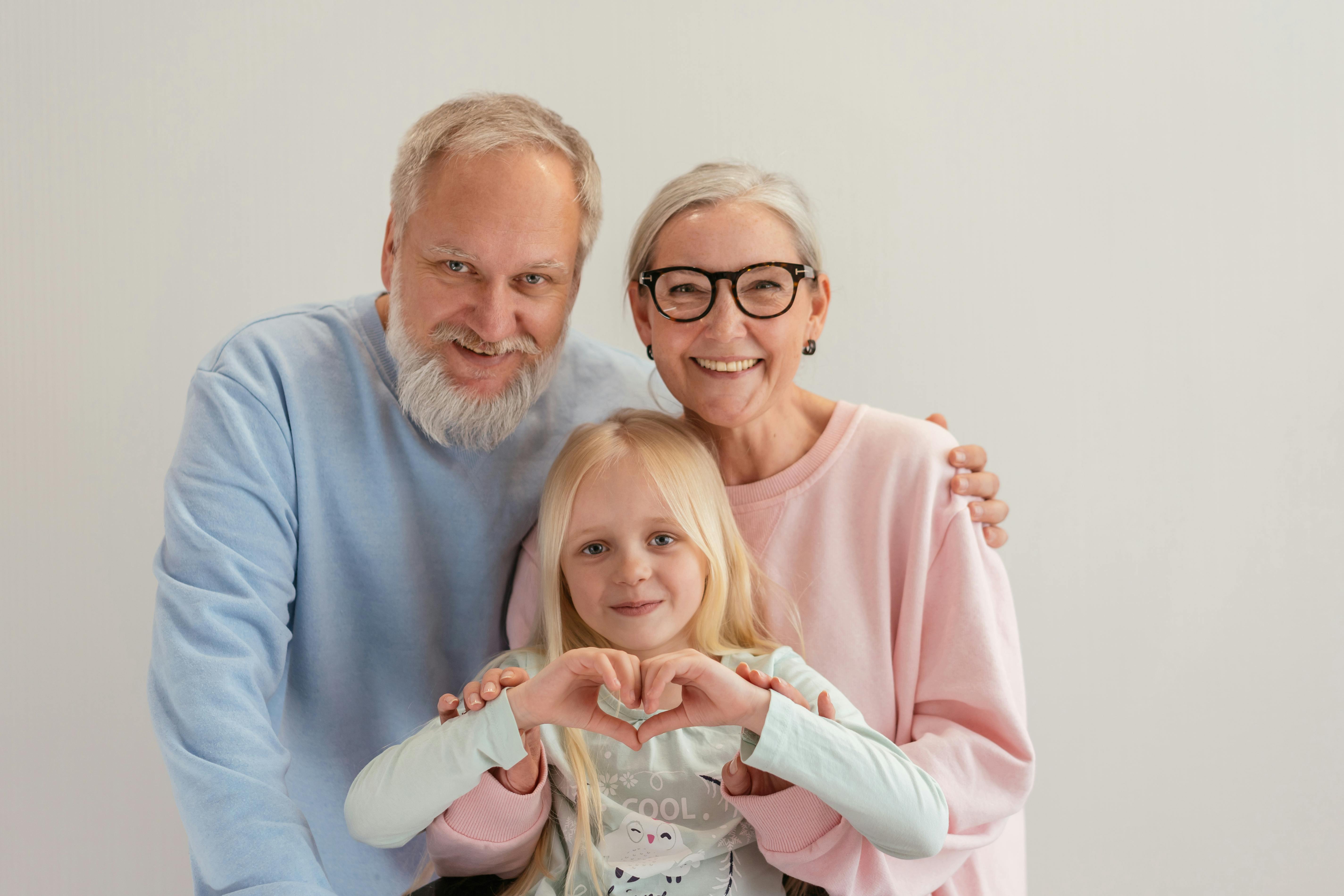 Happy grandparents with their grandkid | Source: Pexels