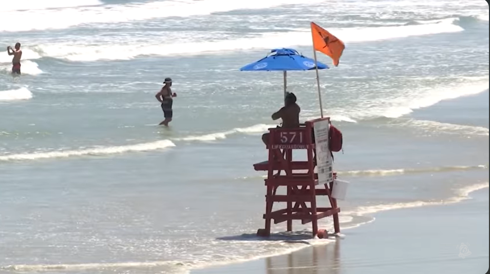 A lifeguard is seen at his post on Volusia County Beach in footage dated June 23, 2025 | YouTube/@News6WKMG