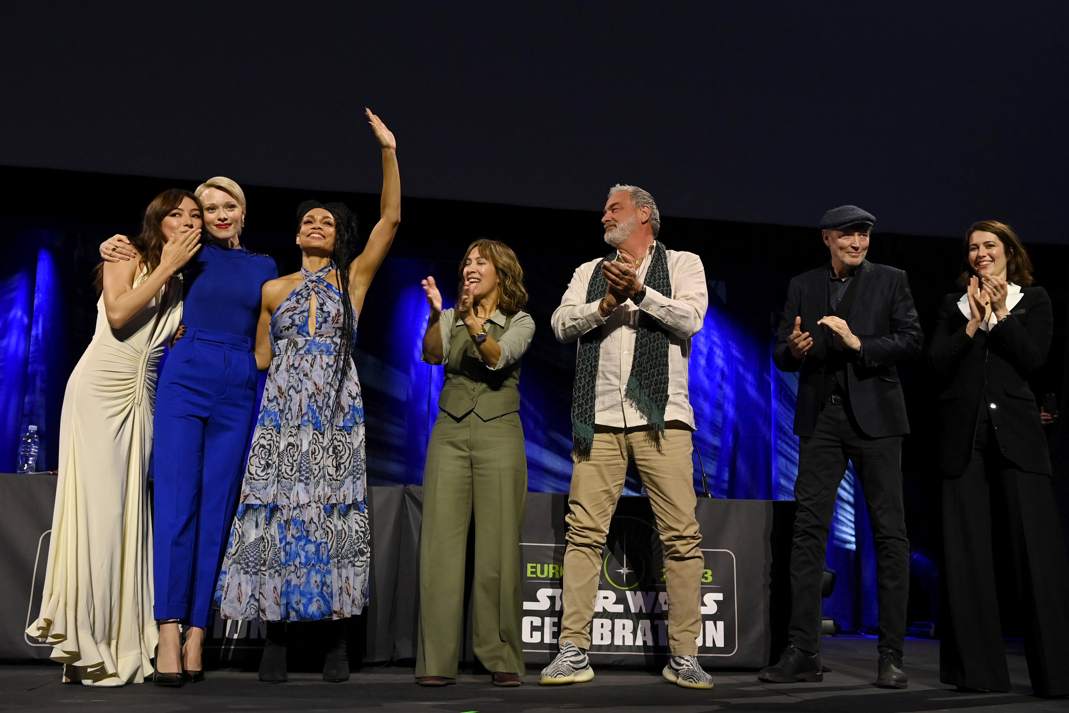 (L-R) Natasha Liu Bordizzo, Ivanna Sakhno, Rosario Dawson, Diana Lee Inosanto, Ray Stevenson, Lars Mikkelson, and Mary Elizabeth Winstead during the "Ahsoka" panel at the "Star Wars Celebration 2023 in London, " at ExCel, on April 8, 2023 in London, England | Source: Getty Images