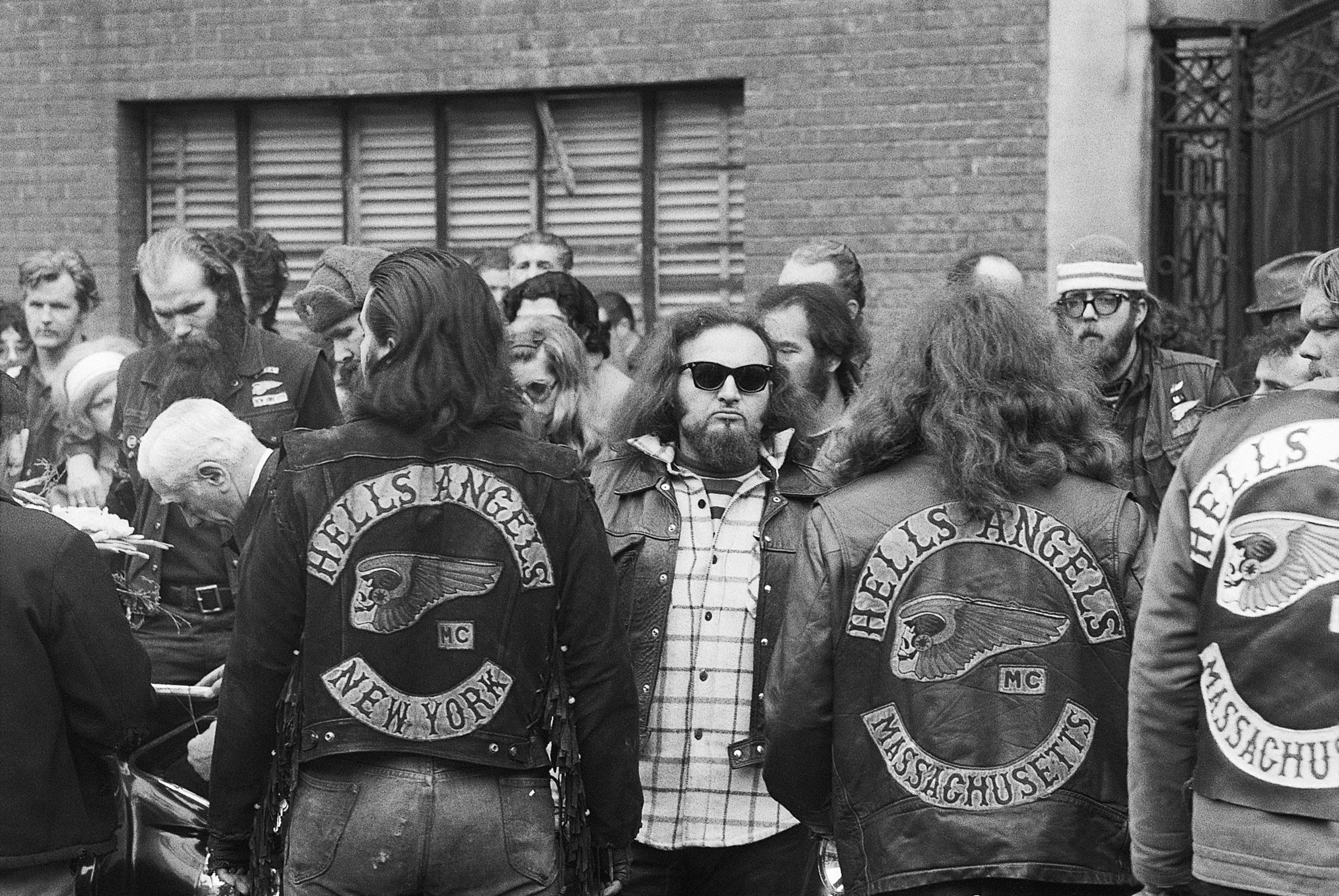 Sporting their long hair and denim jackets, members of the Hell's Angels motorcycle gang gather behind the hearse on the Lower East Side in 1971 to wish a final farewell to a comrade. | Source: Getty Images