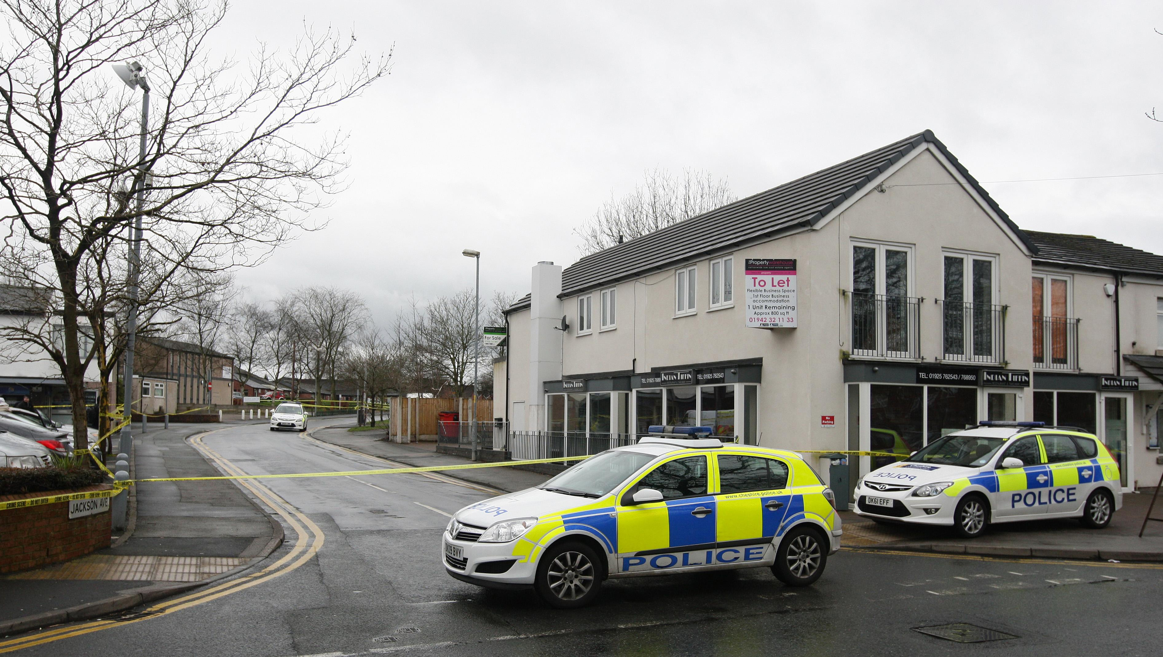 Police officers at a crime scene in Warrington, United Kingdom. | Source: Getty Images