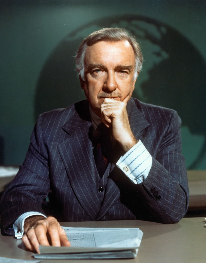 Portrait of American broadcast journalist Walter Cronkite as he sits at the anchor desk on the set of the 'CBS Evening News,' 1974. | Source: Getty Images