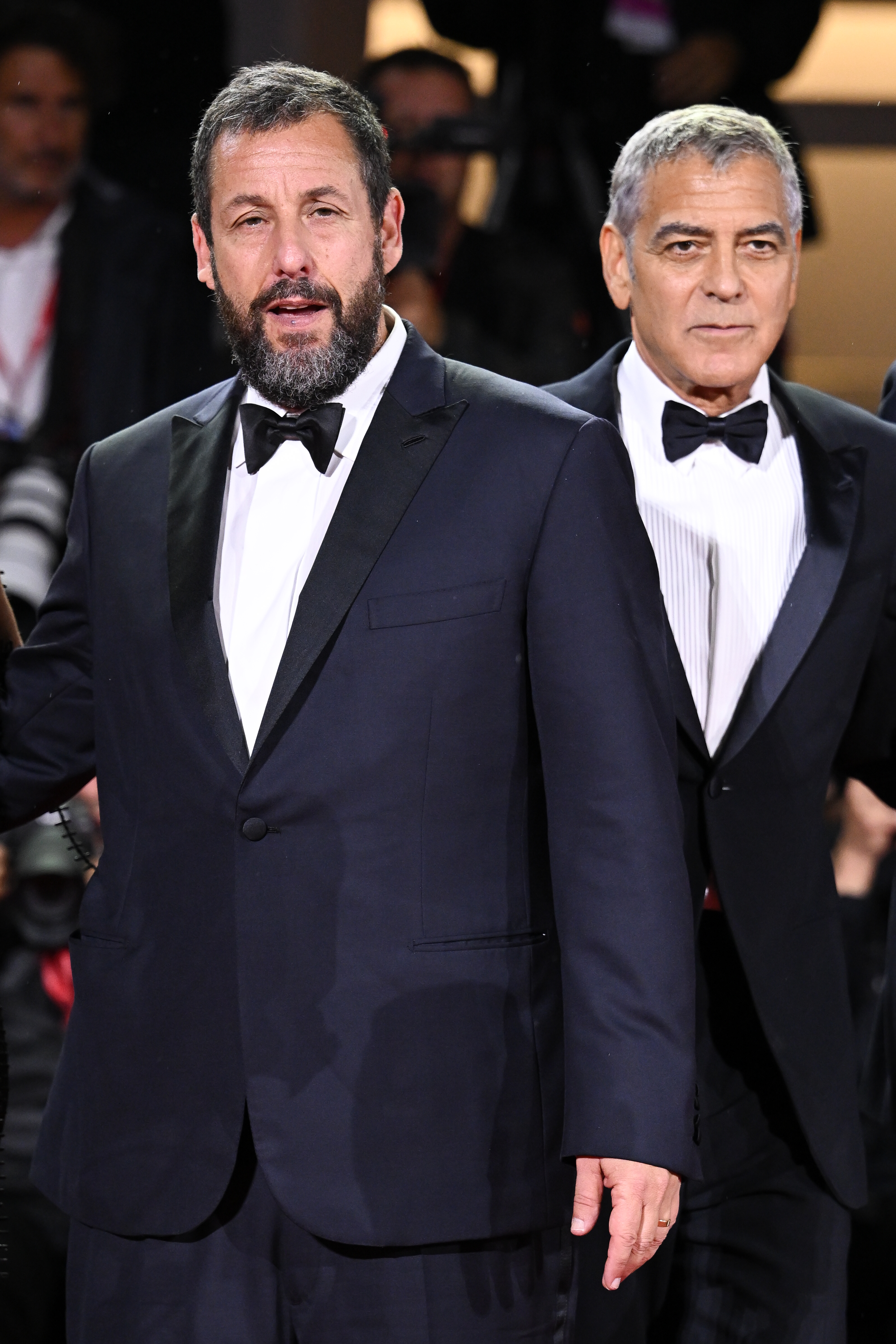 Adam Sandler and George Clooney attend the "Jay Kelly" red carpet during the 82nd Venice International Film Festival on August 28, 2025, in Italy | Source: Getty Images