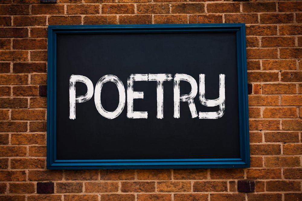 Conceptual hand writing showing the word "Poetry" written in a frame | Photo: Shutterstock/Artur Szczybylo