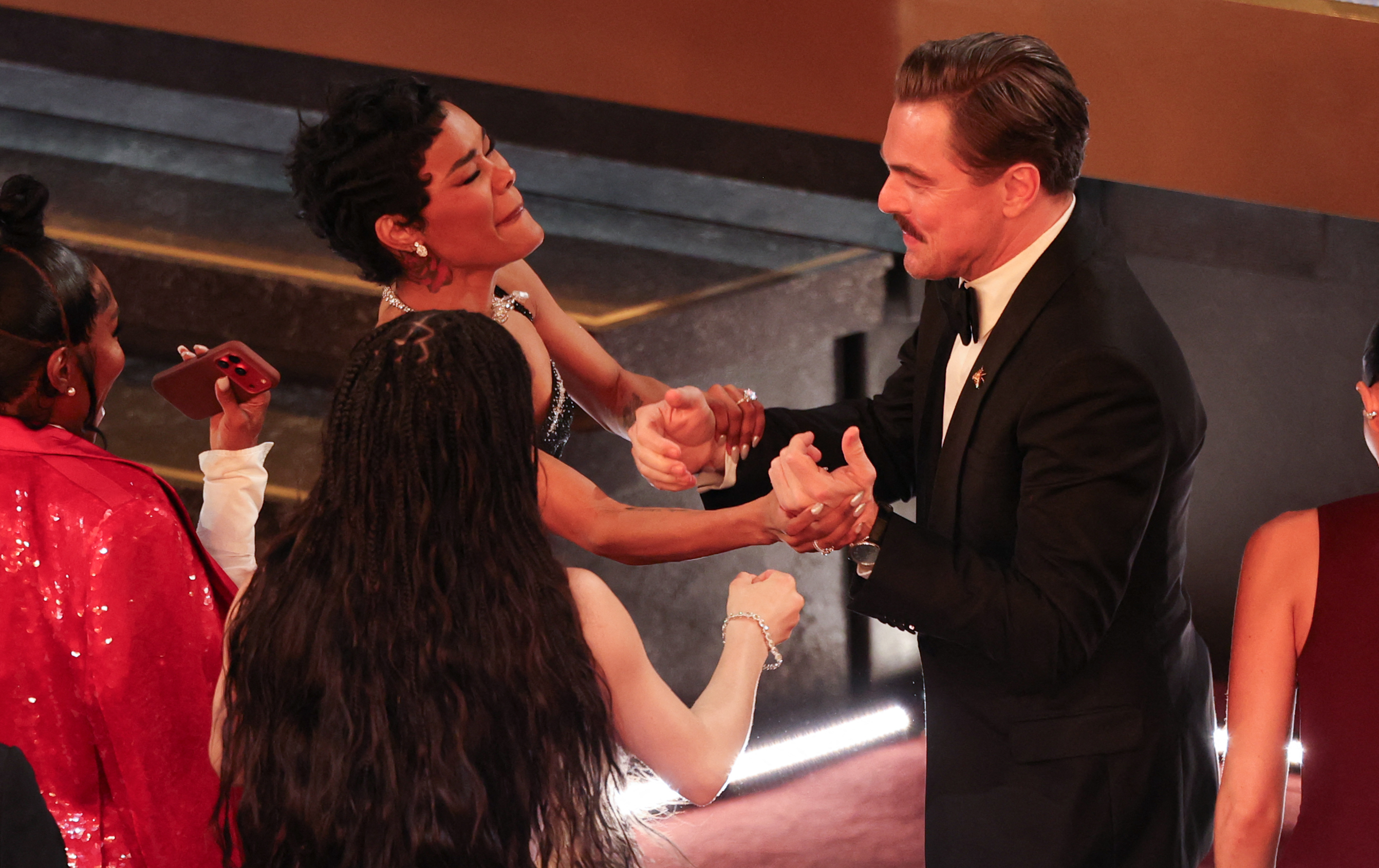 Leonardo DiCaprio and Teyana Taylor celebrate the award for Best Picture for "One Battle After Another" during the 98th Annual Academy Awards in Hollywood, California on March 15, 2026. | Source: Getty Images