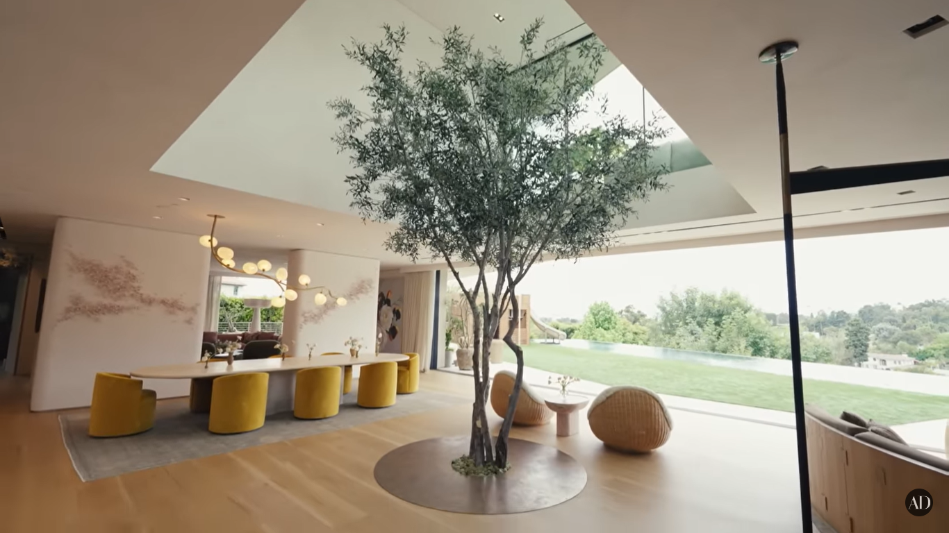 An olive tree in Chrissy Teigen and John Legend's Beverly Hills home | Source: YouTube/ArchitecturalDigest