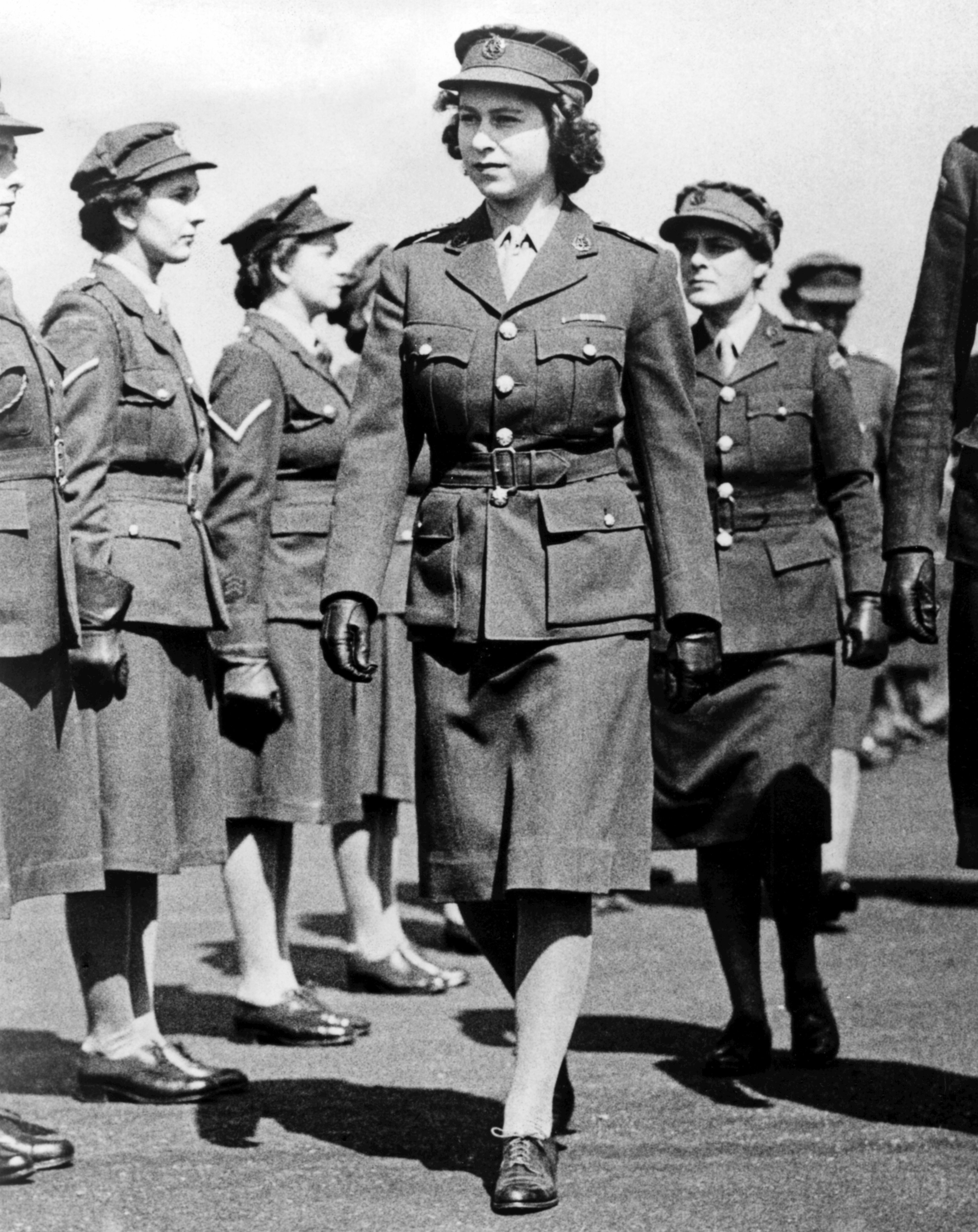Princess Elizabeth as Junior Commander in the ATS inspecting The Motor Transport Training Centre at Camberley, Surrey during the Second World War. Circa May 1945. | Source: Getty Images