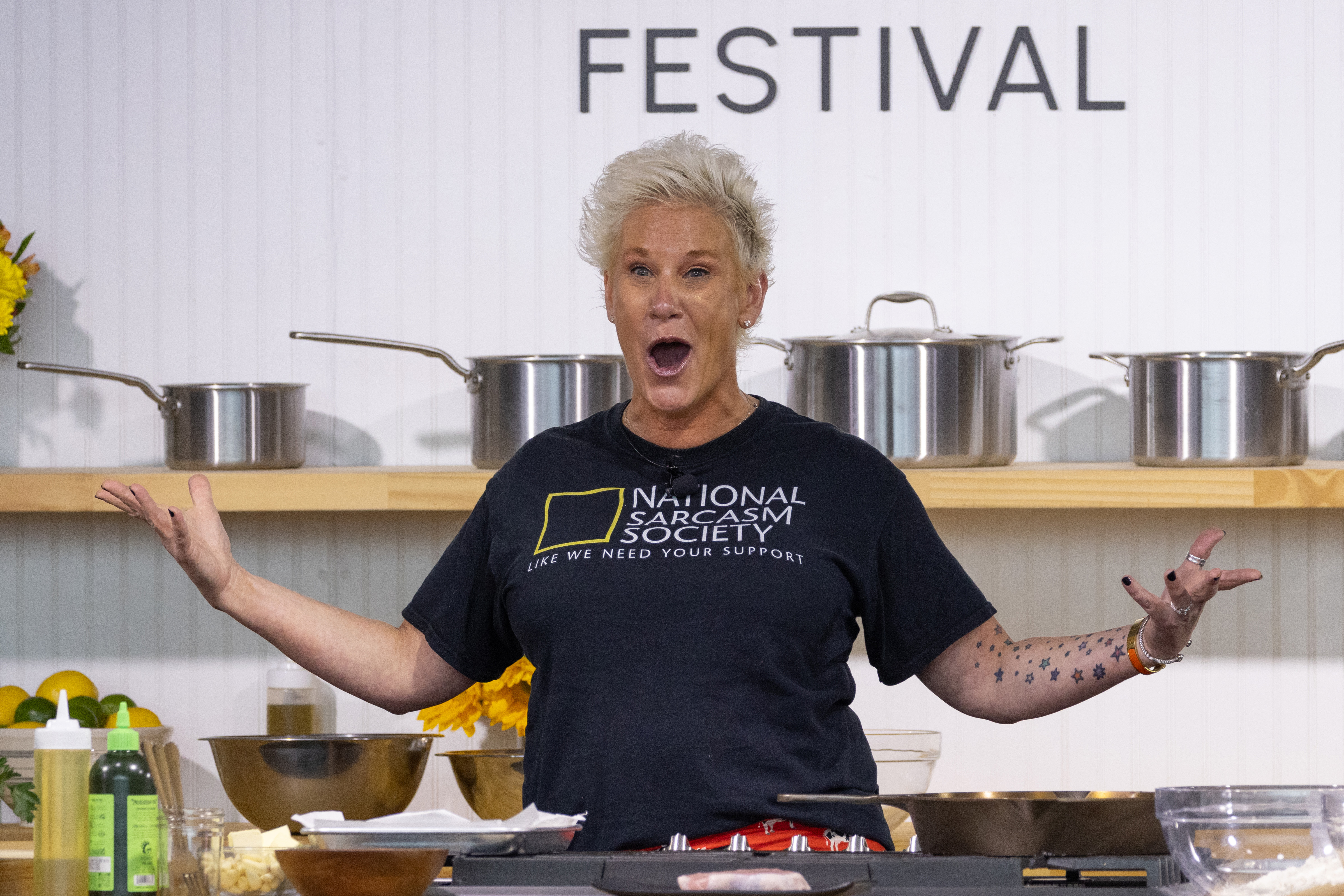 Chef Anne Burrell enthusiastically demonstrates a recipe on stage during the Austin Food & Wine Festival in Texas, on November 5, 2023 | Source: Getty Images