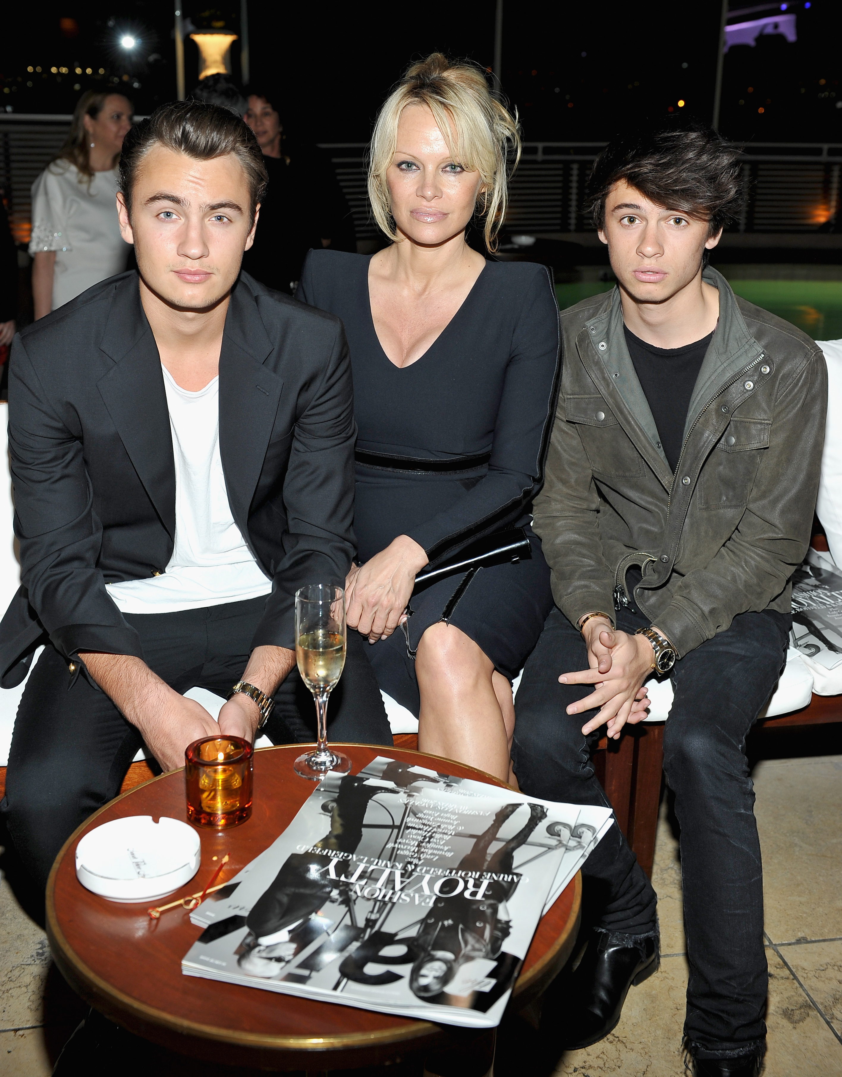 Pamela Anderson (C) and her sons Brandon Thomas Lee (L) and Dylan Jagger Lee attend The Daily Front Row "Fashion Los Angeles Awards" 2016, at Sunset Tower Hotel, on March 20, 2016, in West Hollywood, California.| Source: Getty Images