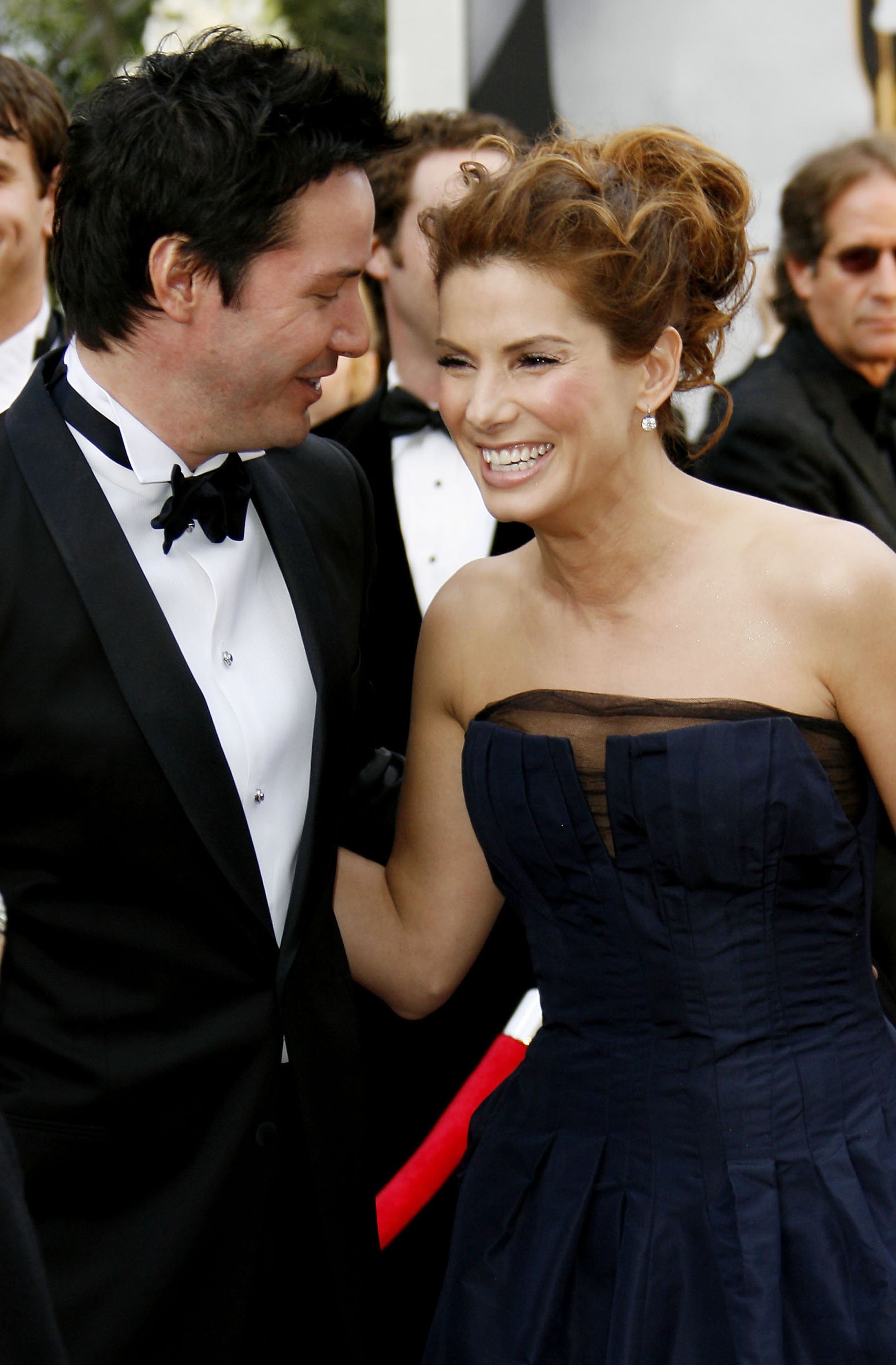 Sandra Bullock and Keanu Reeves during The 78th Annual Academy Awards - Red Carpet at Kodak Theatre in Hollywood, California | Source: Getty Images