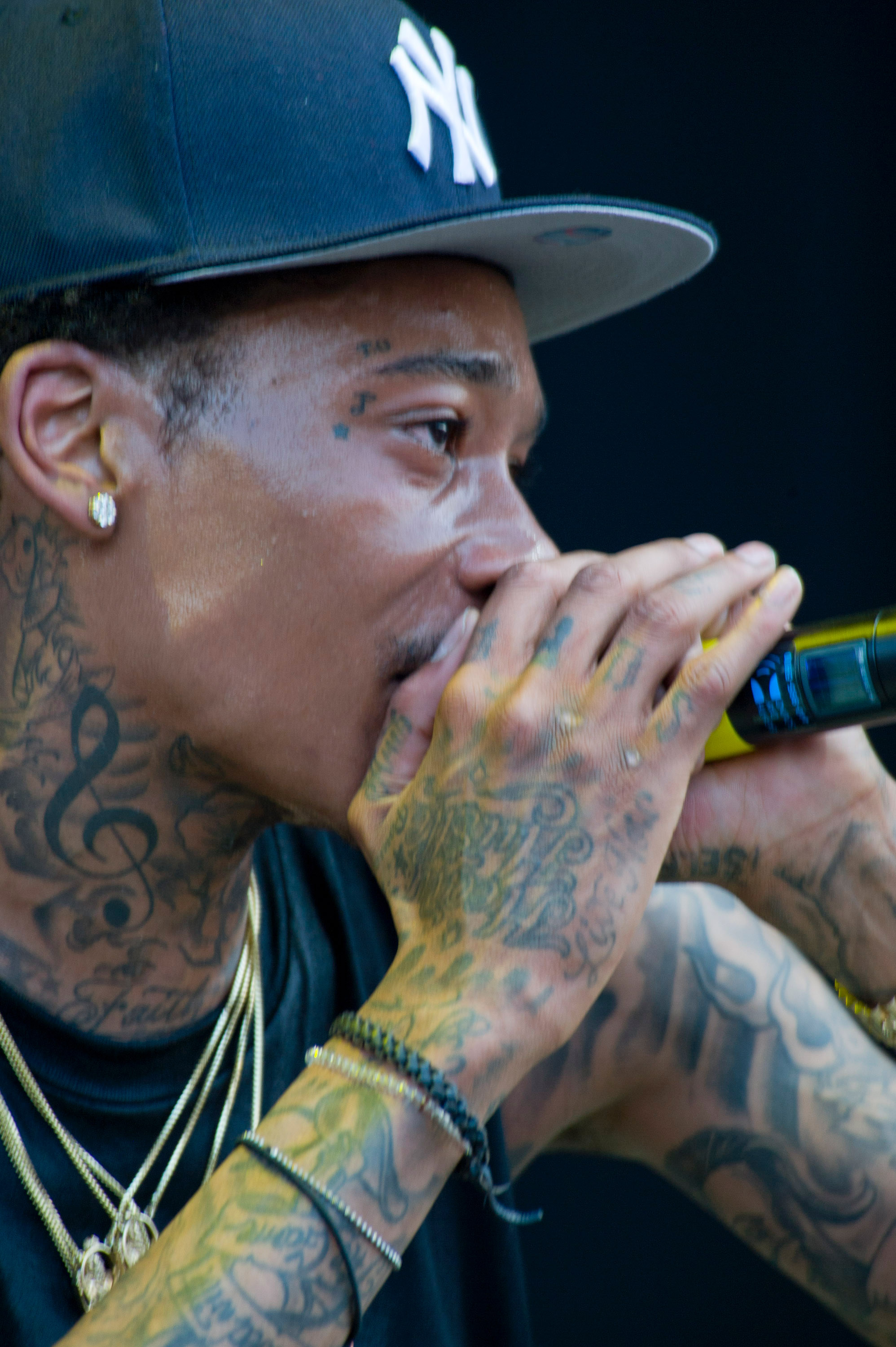 A close-up of Wiz Khalifa's tattoos captured while he performed onstage during Bonnaroo 2011 at What Stage on June 11, 2011, in Manchester, Tennessee. | Source: Getty Images