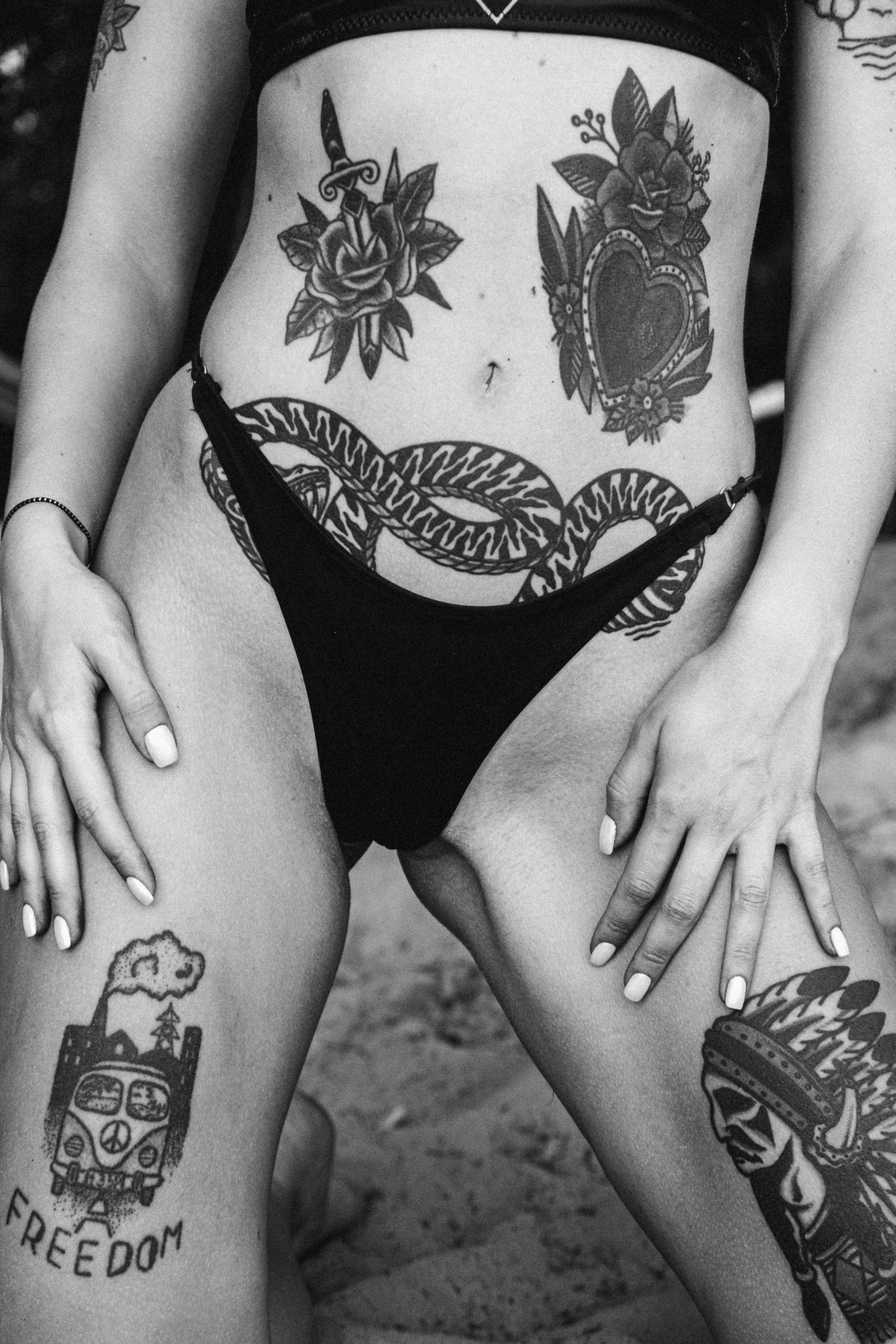 A woman revealing her tattoos | Source: Unsplash