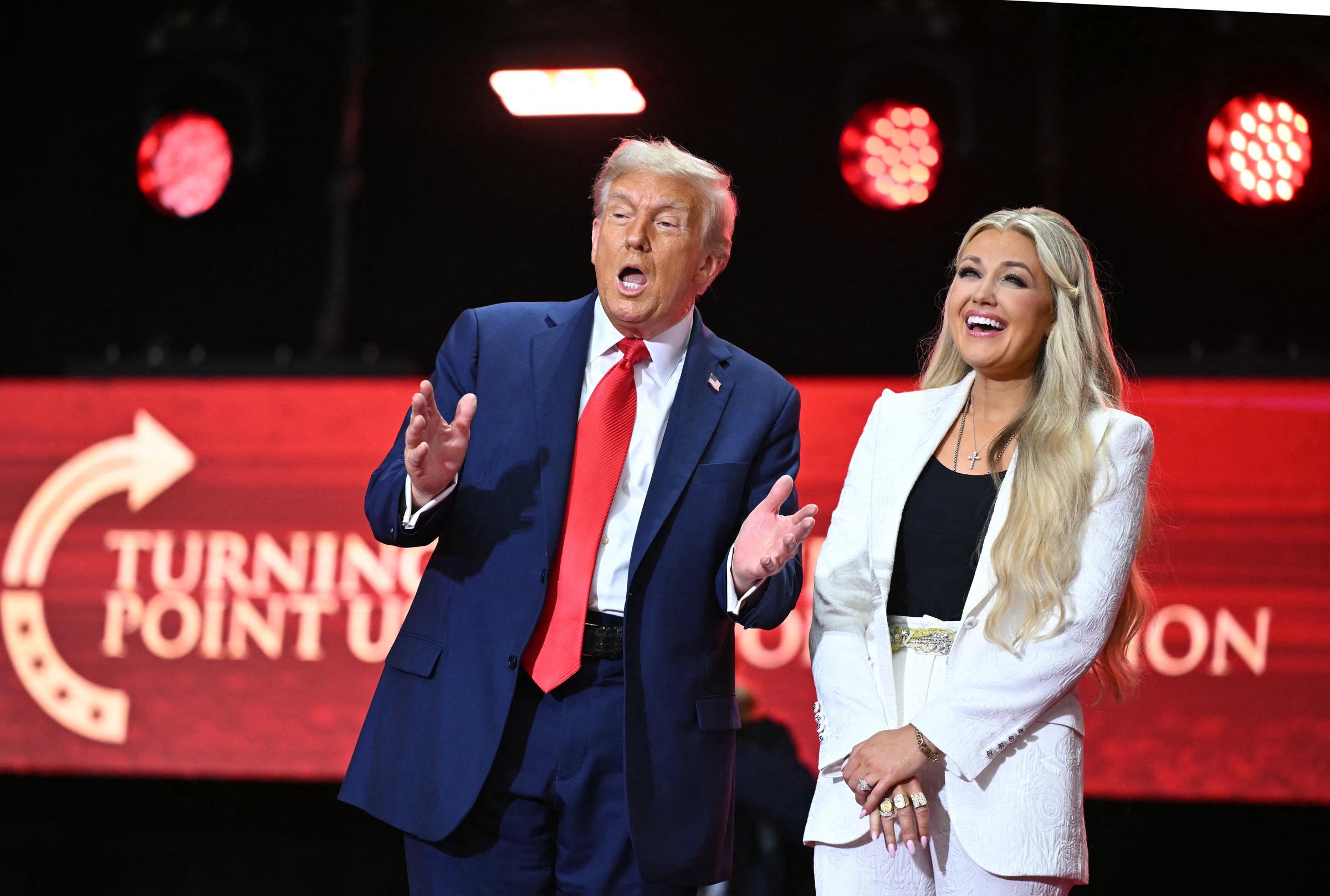 President Donald Trump stands next to Erika Kirk, after speaking at the public memorial service for Charlie Kirk at State Farm Stadium on September 21, 2025 | Source: Getty Images