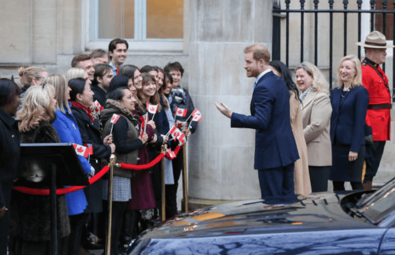 Prince Harry and Meghan Markle speak to a crowd of people as they arrive at Canada House, on January 2 2020, in London, England | Source: Steve Taylor/SOPA Images/LightRocket via Getty Images