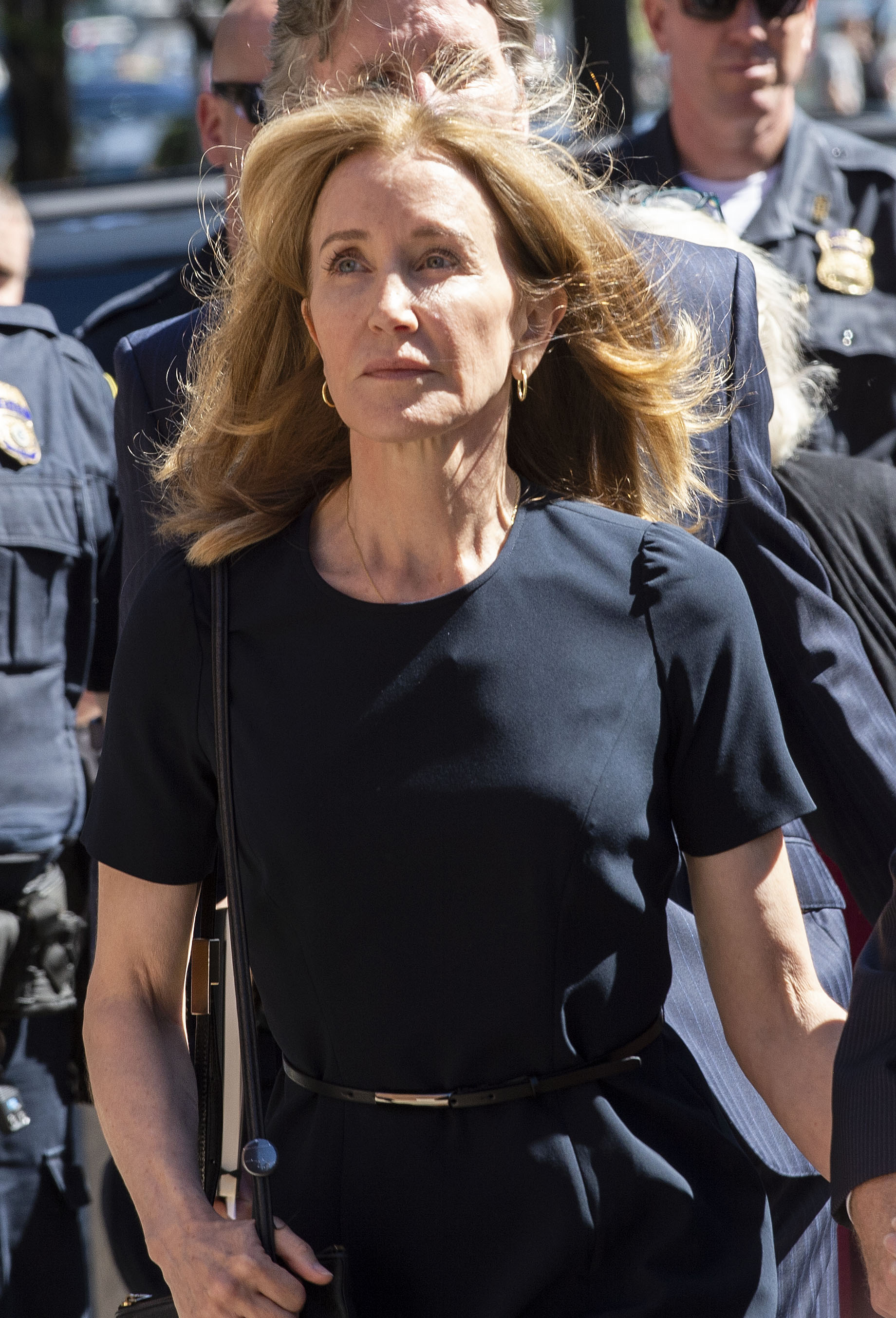 Felicity Huffman makes her way to the entrance of the John Joseph Moakley United States Courthouse on September 13, 2019 in Boston. | Source: Getty Images