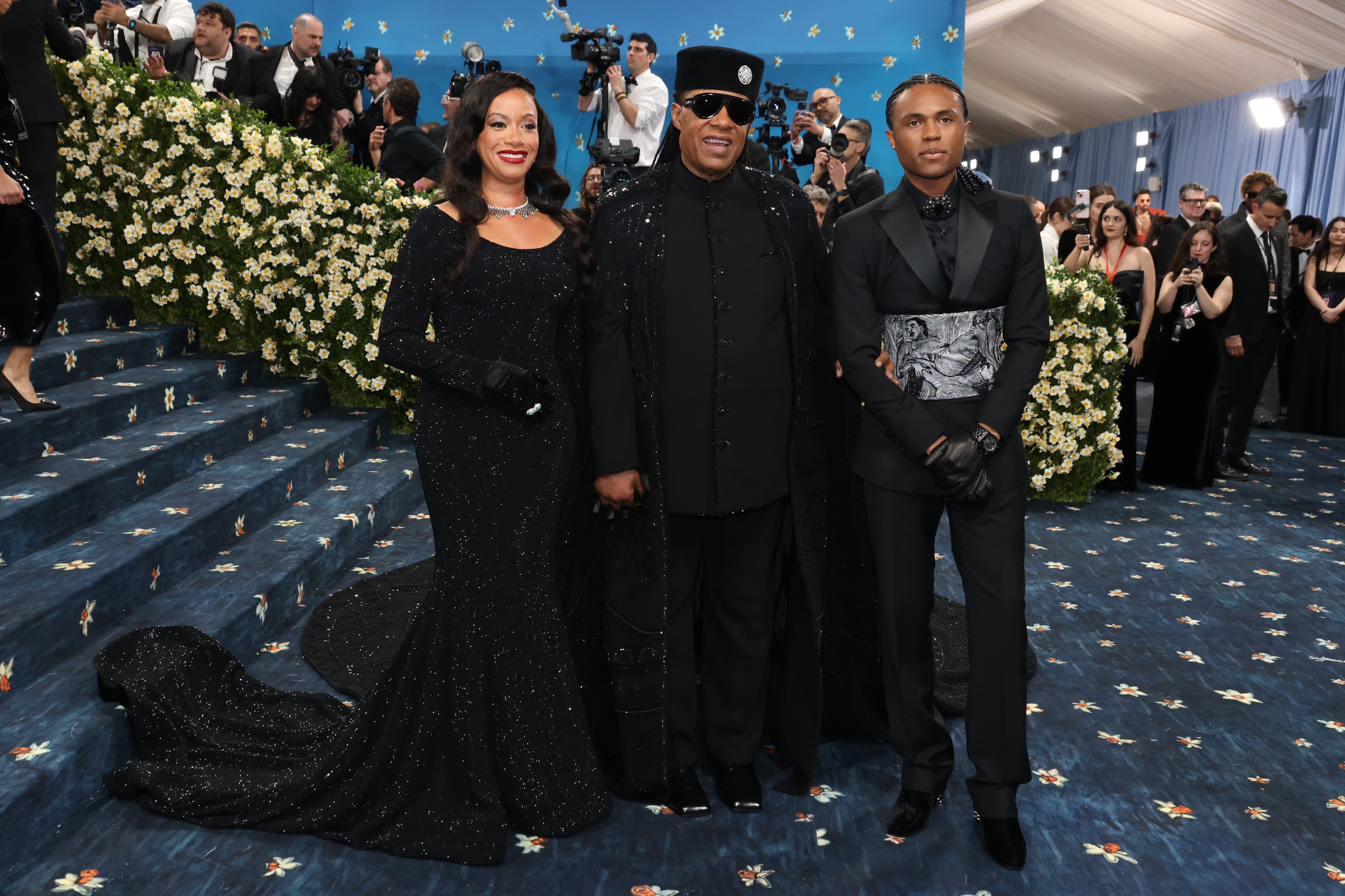 Tomeeka Robyn Bracy, Stevie Wonder, and Kailand Morris complemented each other with their all-black ensemble at the Met Gala.