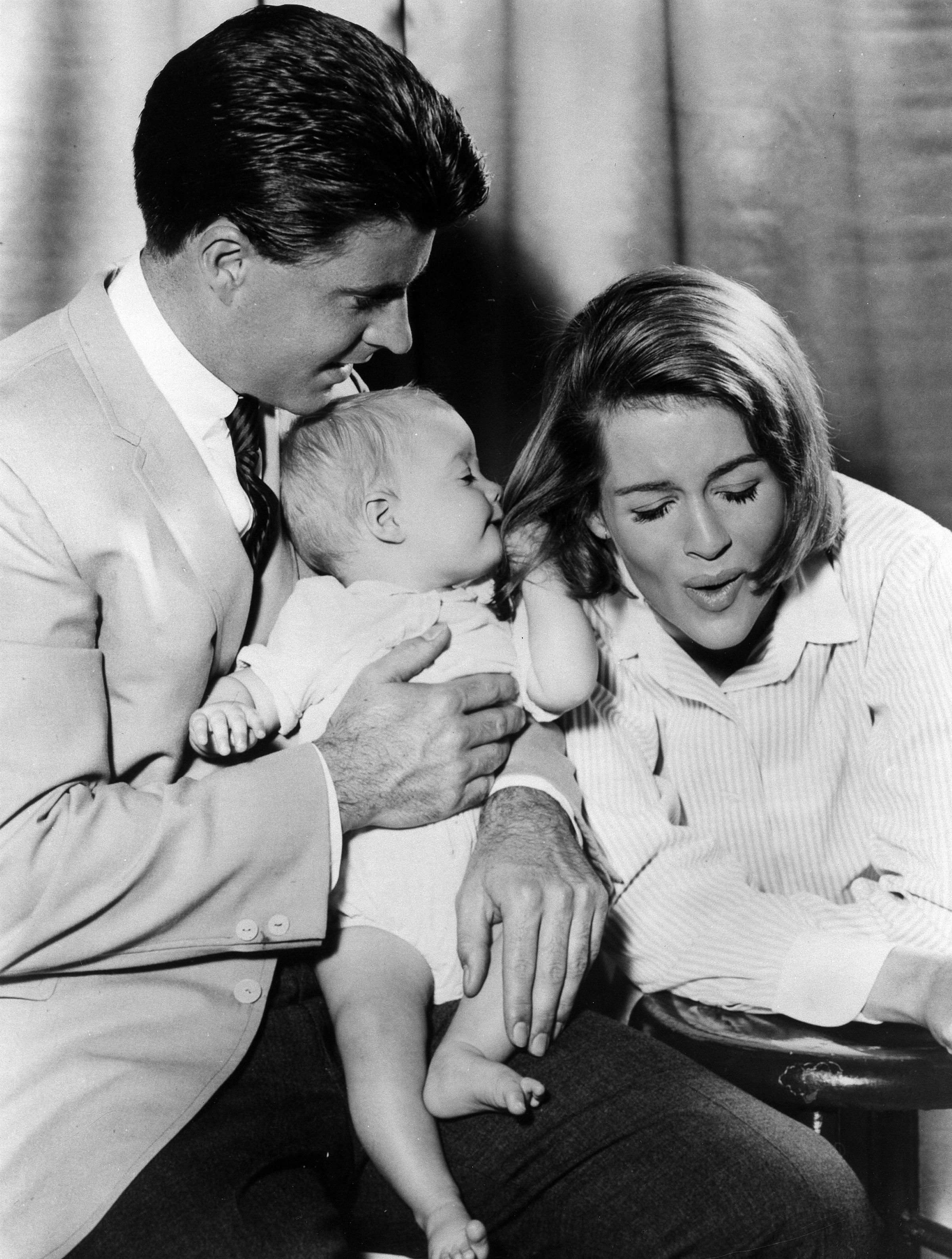 Ricky and Kristin Nelson, and their 6 month old daughter Tracy Nelson pose for a portrait in 1963 | Source: Getty Images