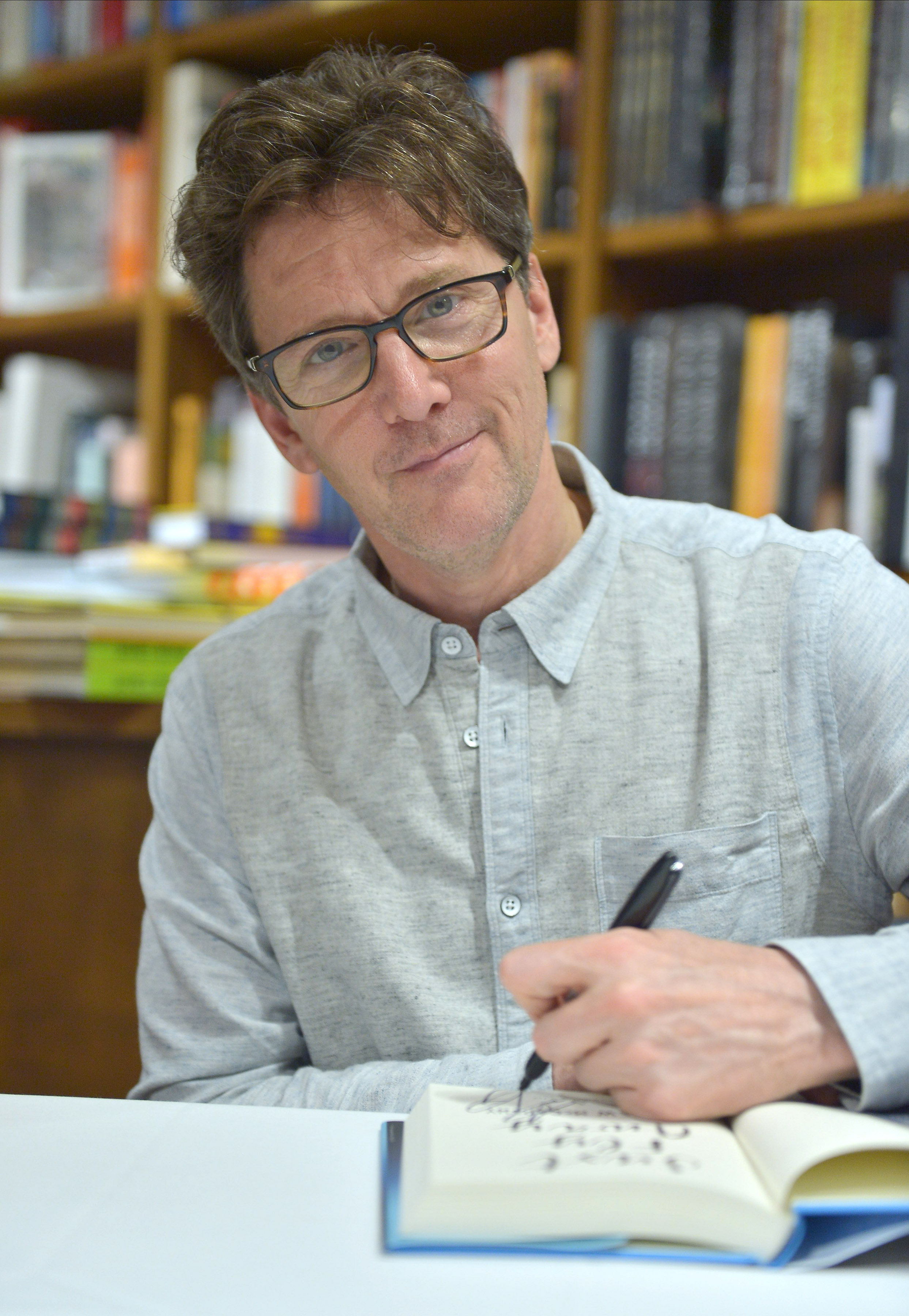 Andrew McCarthy signing copies of his book "Just Fly Away" on April 21, 2017, in Coral Gables, Florida. | Source: Getty Images