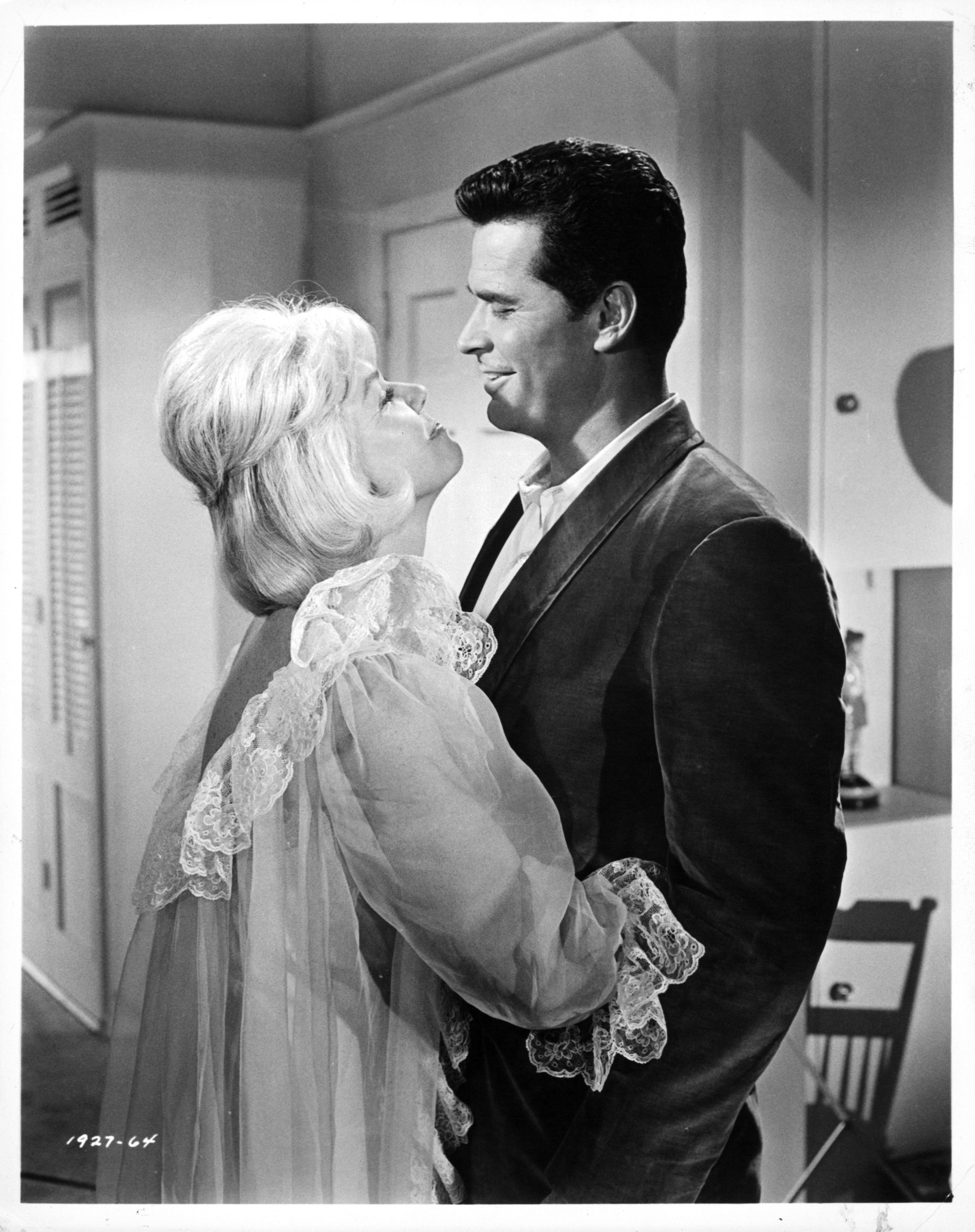 Doris Day and James Garner embracing in a scene from the 1963 film 'The Thrill Of It All.' | Source: Getty Images