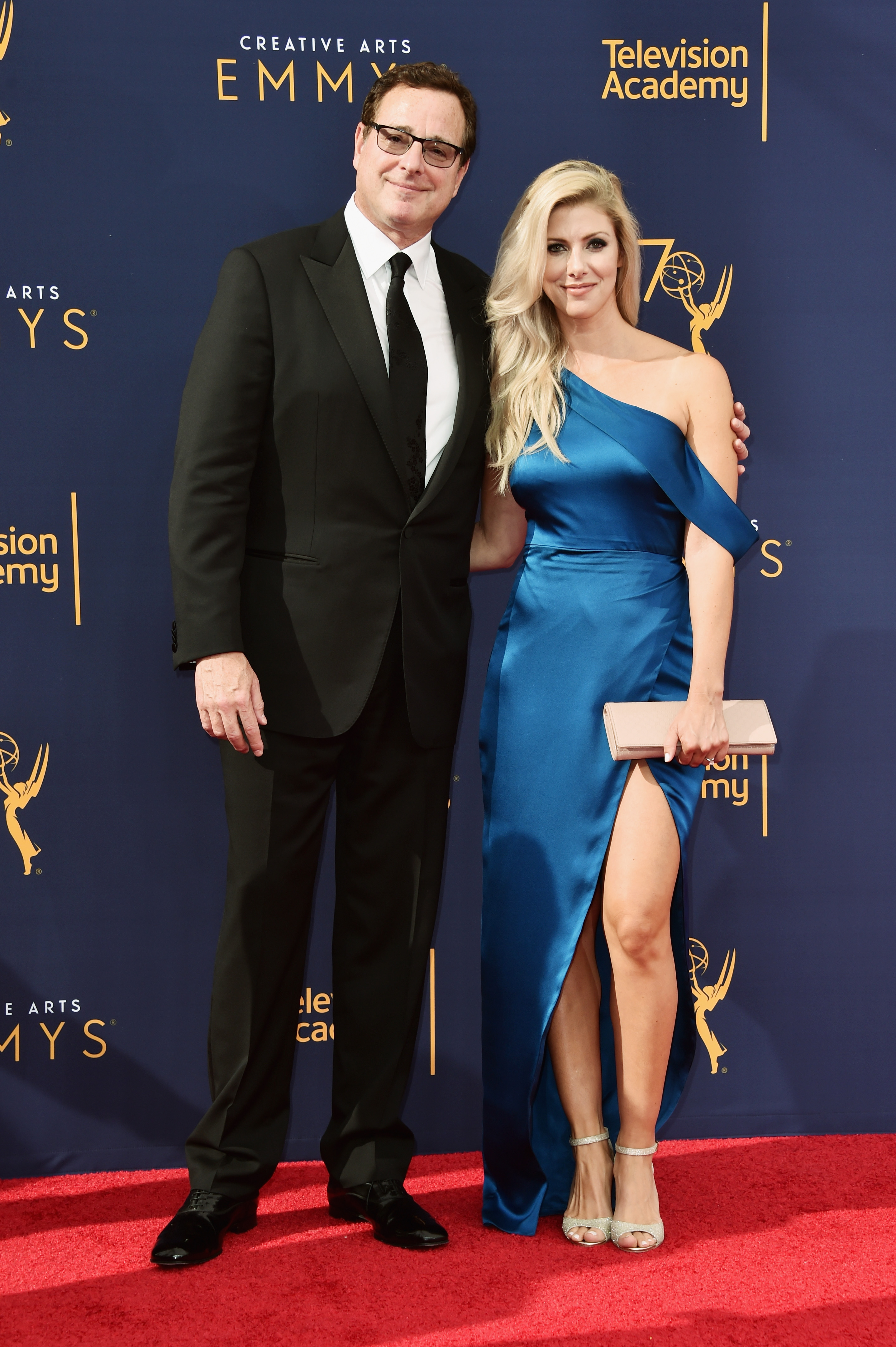 Bob Saget and Kelly Rizzo attend the Creative Arts Emmy Awards at Microsoft Theater in Los Angeles, California on September 8, 2018. | Source: Getty Images