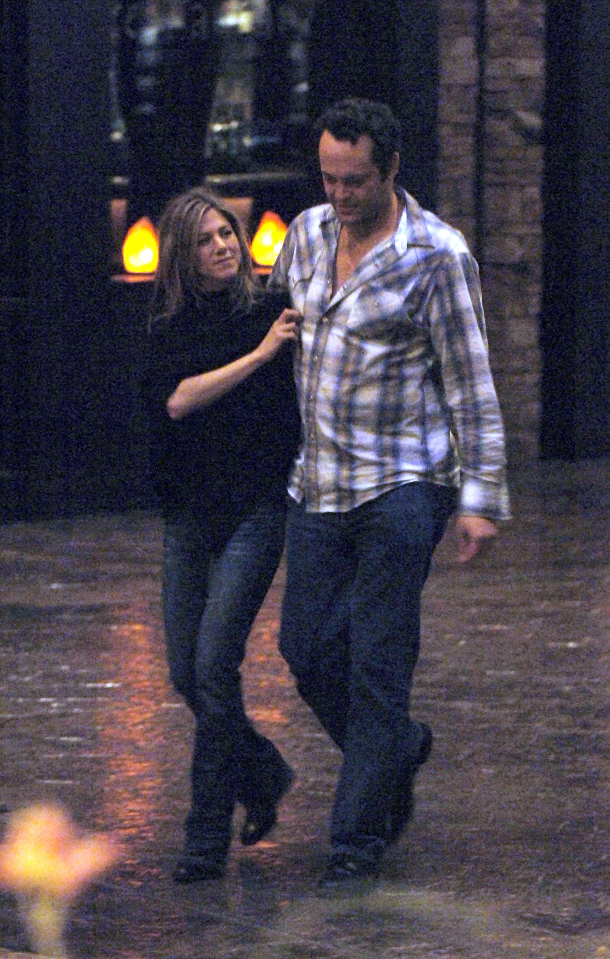 Spotted walking in Las Vegas with Vince Vaughn in January 2006, Jennifer Aniston kept it relaxed in a black long-sleeve top and blue jeans. Her hair was straight and parted in the middle, framing her face as they strolled side by side.