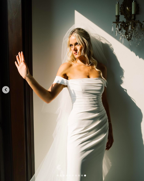 Victoria Schultz posing for a picture in her wedding gown, posted on July 26, 2024 | Source: Instagram/antpagephoto and alenkafilms