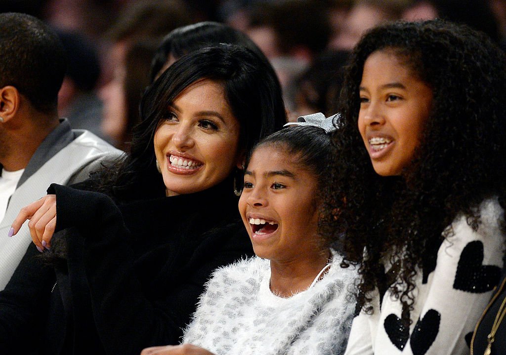 Wife Vanessa Laine Bryant (L) and daughters Gianna Bryant (C), 8, and Natalia Bryant watch Kobe Bryant #24 of the Los Angeles Lakers during the basketball game against Indiana Pacers at Staples Center | Photo: Getty Images
