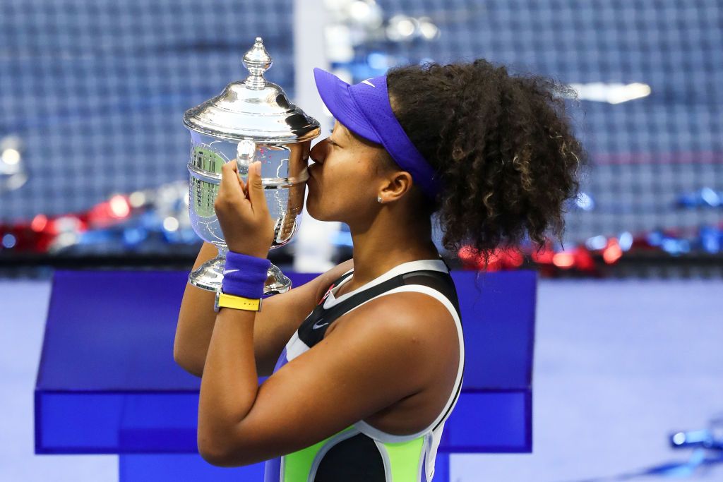 Naomi Osaka kissing the U.S. Open 2020 trophy after winning her Women's Singles finals match against Victoria Azarenkaat the USTA Billie Jean King National Tennis Center in New York City | Photo: Matthew Stockman/Getty Images