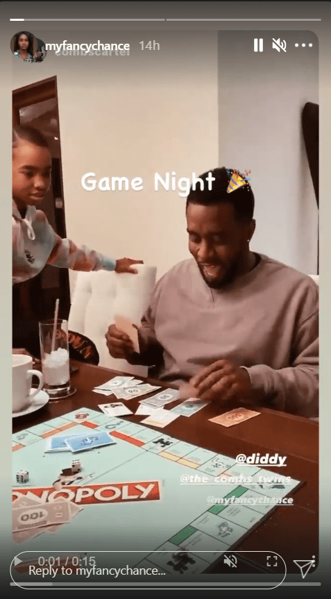 Sean Combs smiling during a game of Monopoly with his daughters | Photo: Instagram/myfancychance