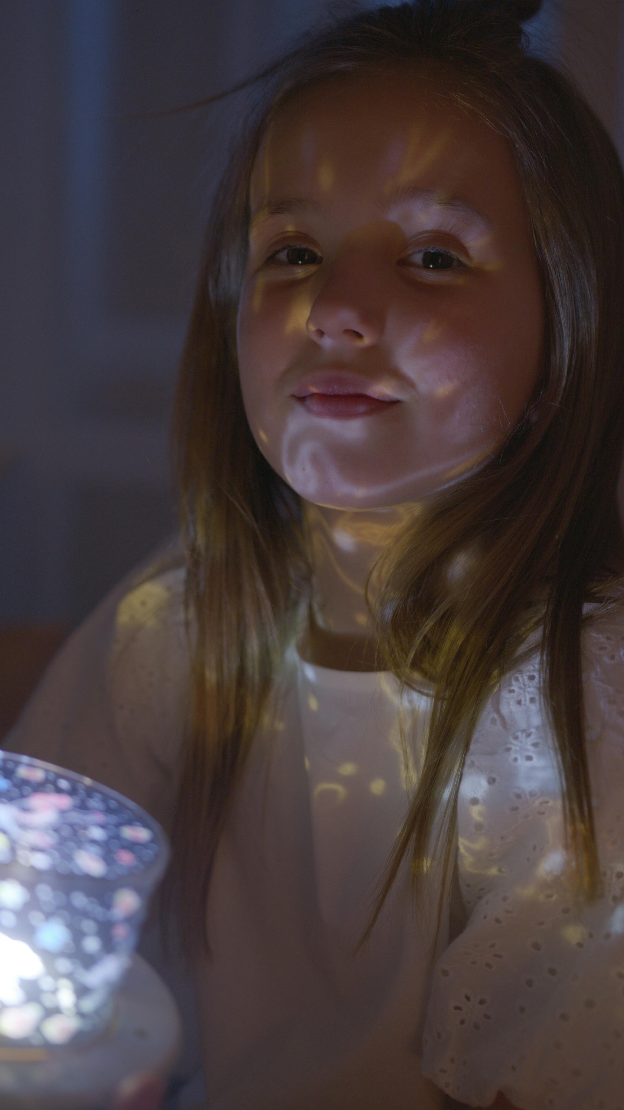 A smiling girl in her room | Source: Pexels