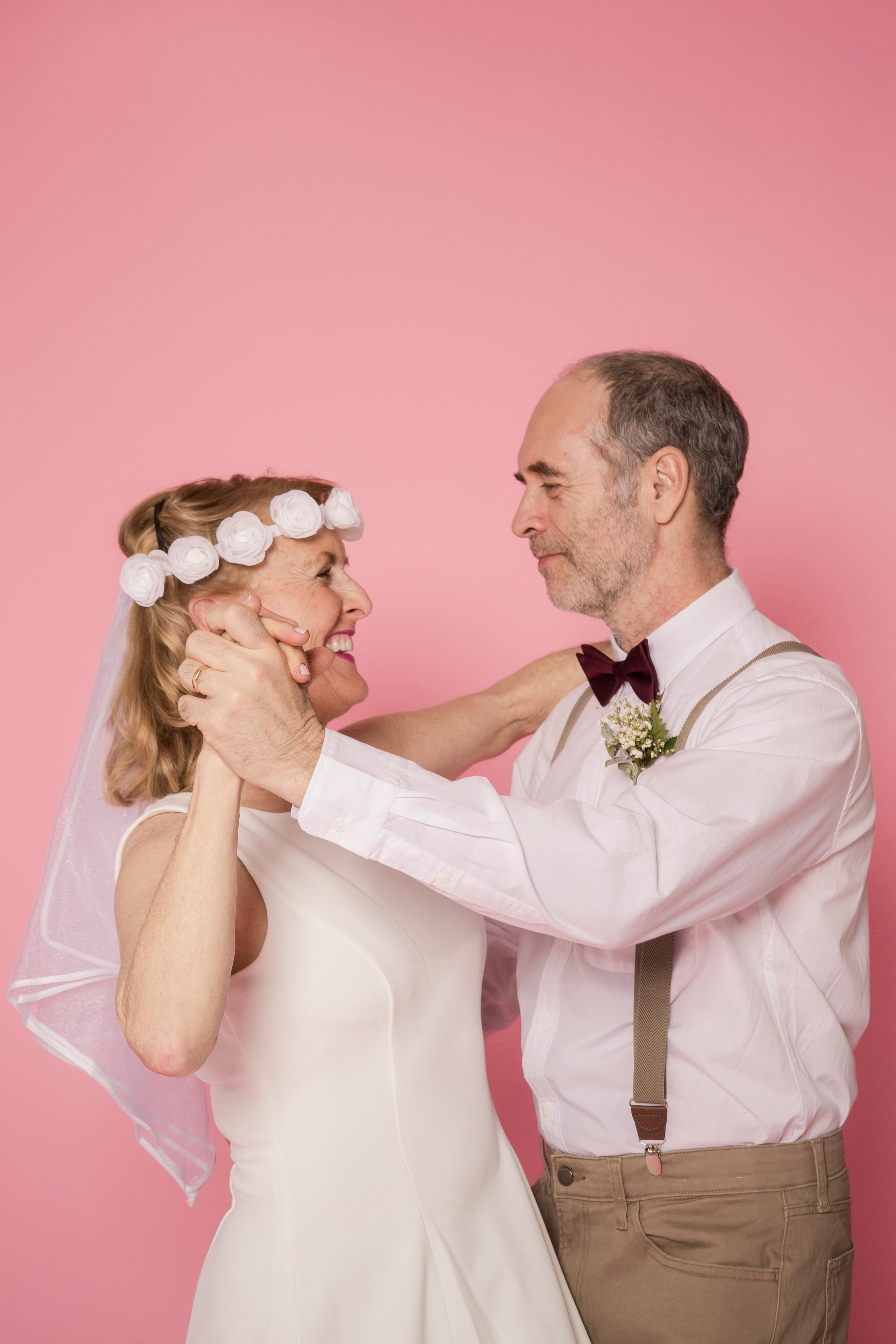 A woman in a wedding dress dancing with her partner | Source: Pexels