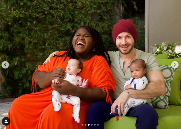 A screenshot of Gabourey Sidibe and Brandon Frankel with their twins, Maya and Cooper, from a post dated June 8, 2024. | Source: Instagram/brandontour