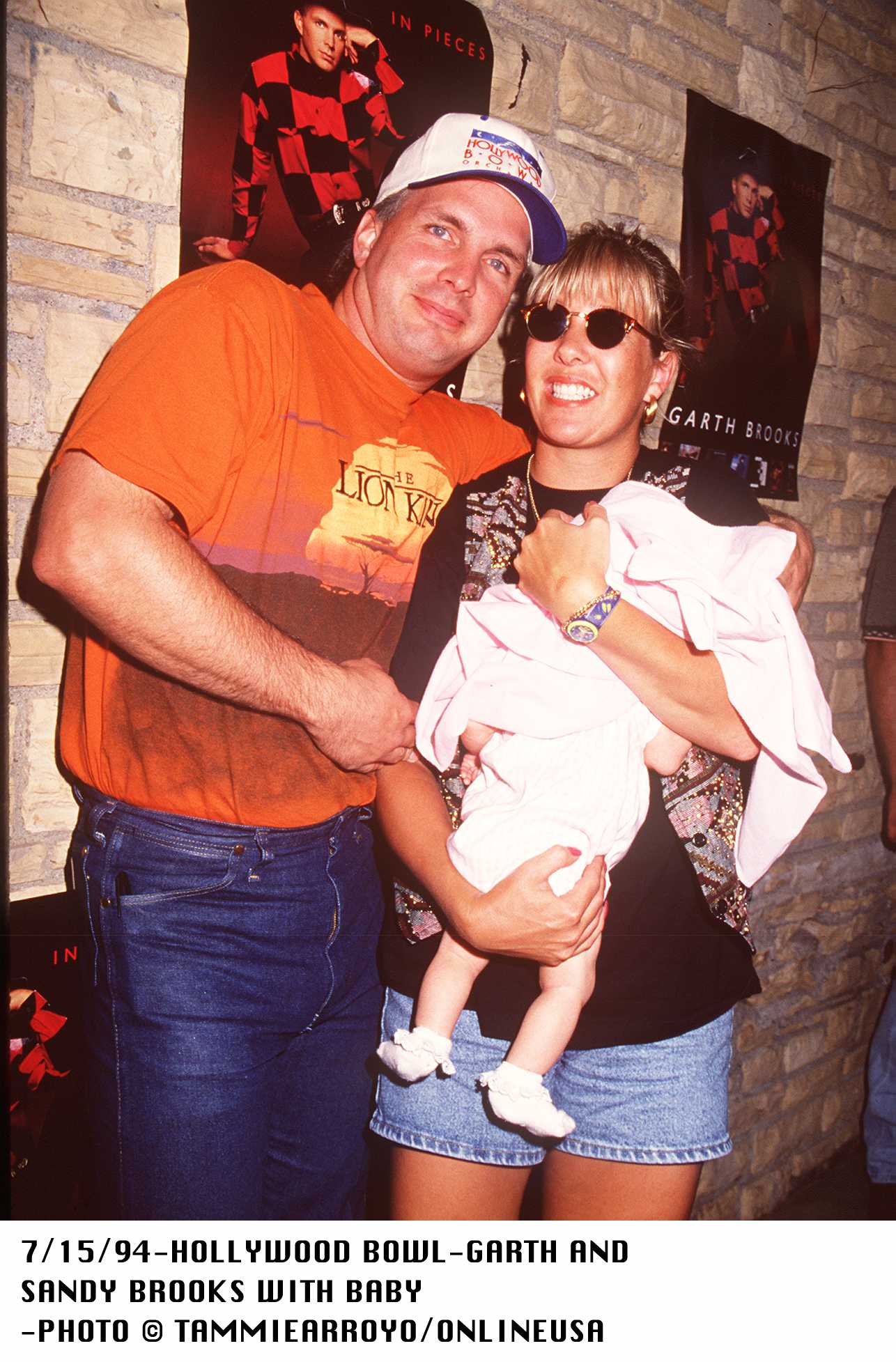 Garth Brooks and his wife Sandy Brooks with their baby at the Hollywood Bowl on July 15, 1994 | Source: Getty Images